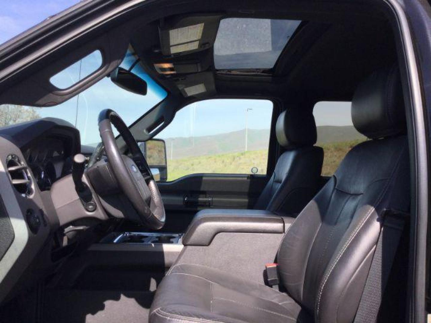 2012 Black /Black Leather Interior Ford F-350 SD Lariat Crew Cab 4WD (1FT8W3BT6CE) with an 6.7L V8 OHV 16V DIESEL engine, 6-Speed Automatic transmission, located at 1801 Main Street, Lewiston, 83501, (208) 743-9371, 46.417065, -117.004799 - Photo#5