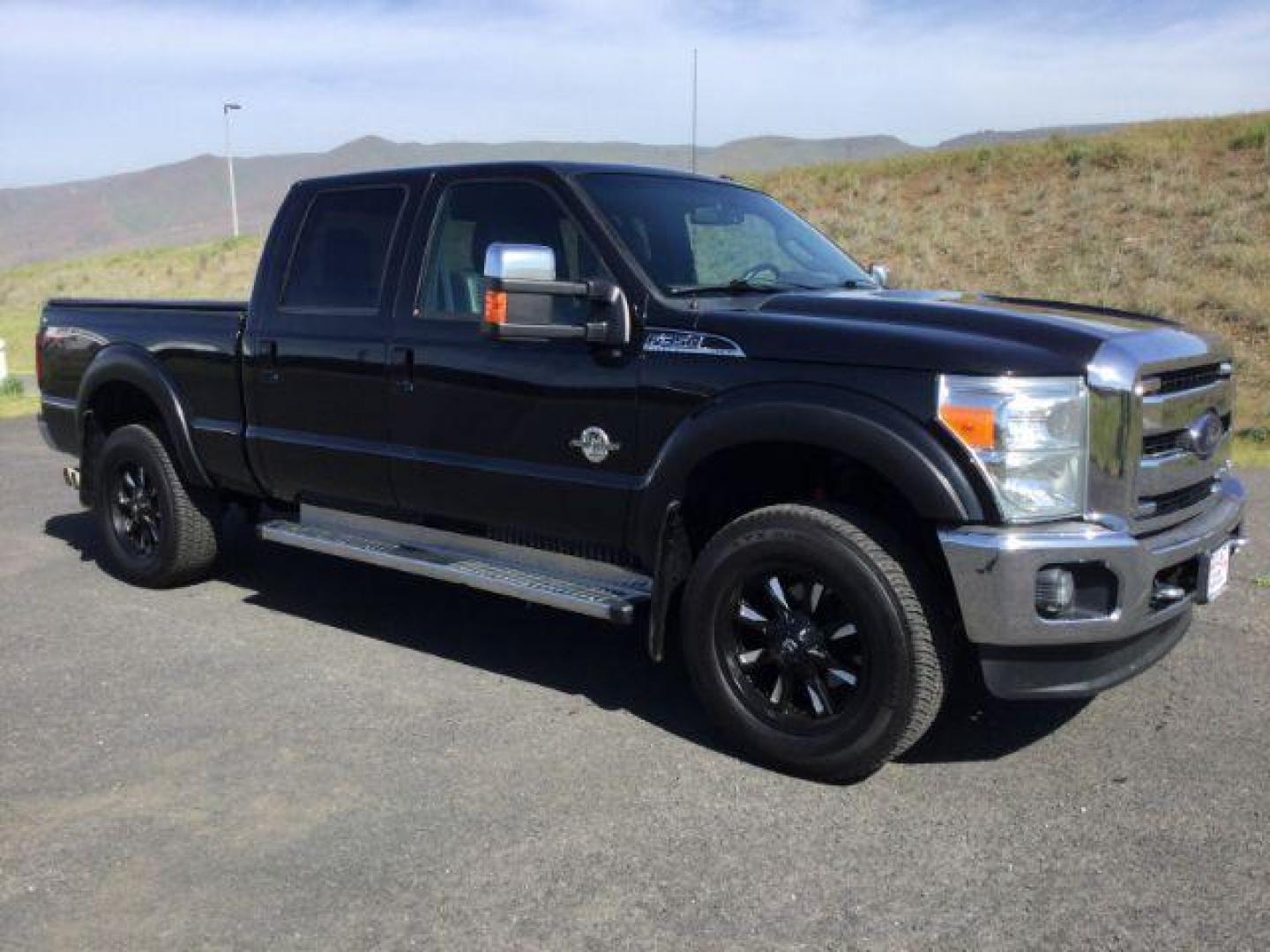 2012 Black /Black Leather Interior Ford F-350 SD Lariat Crew Cab 4WD (1FT8W3BT6CE) with an 6.7L V8 OHV 16V DIESEL engine, 6-Speed Automatic transmission, located at 1801 Main Street, Lewiston, 83501, (208) 743-9371, 46.417065, -117.004799 - Photo#8