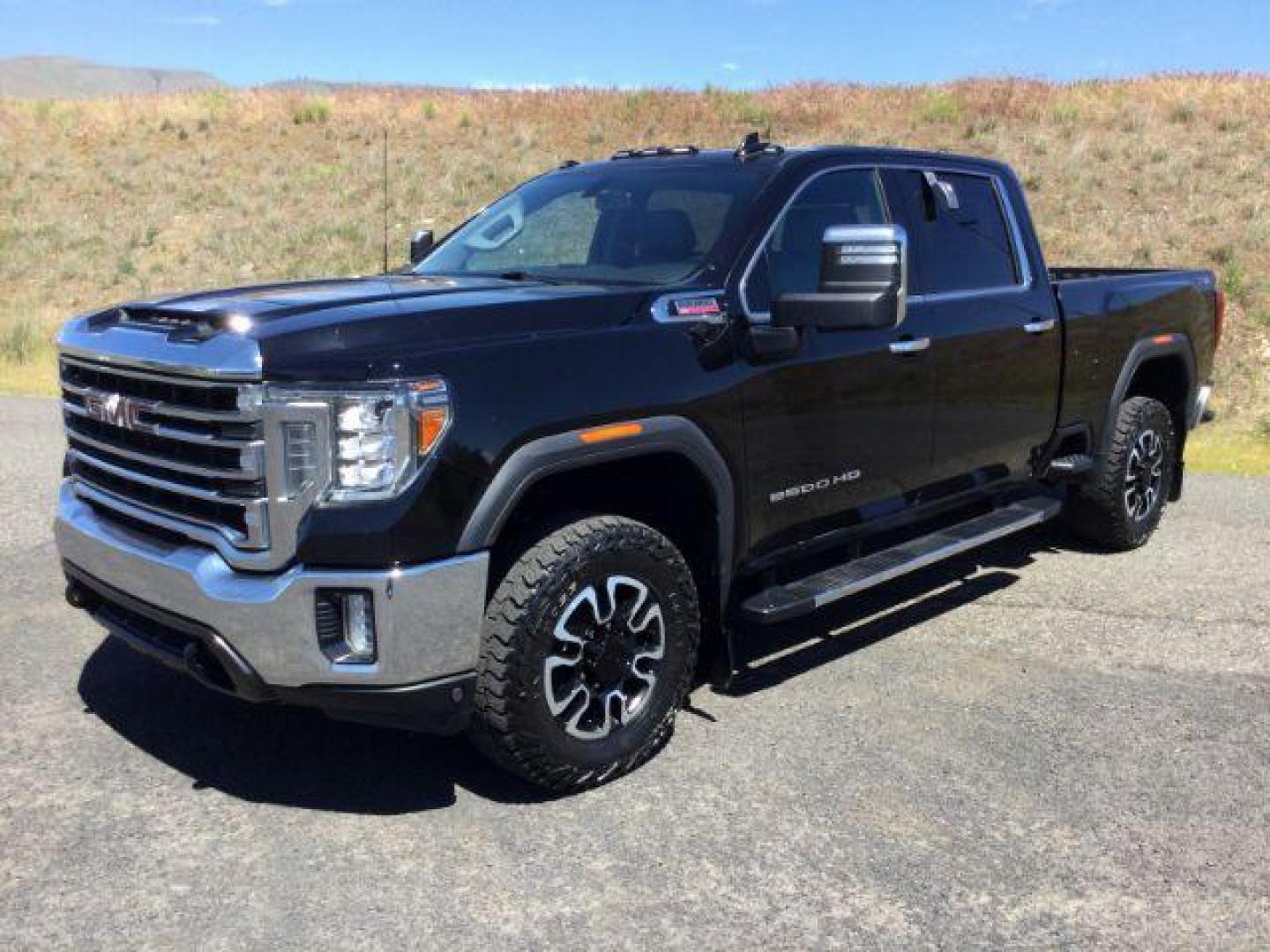 2020 Onyx Black /Jet Black, leather GMC Sierra 2500HD SLT Crew Cab 4WD (1GT49NEYXLF) with an 6.6L V8 OHV 16 DIESEL engine, 10 Speed Automatic transmission, located at 1801 Main Street, Lewiston, 83501, (208) 743-9371, 46.417065, -117.004799 - Photo#0