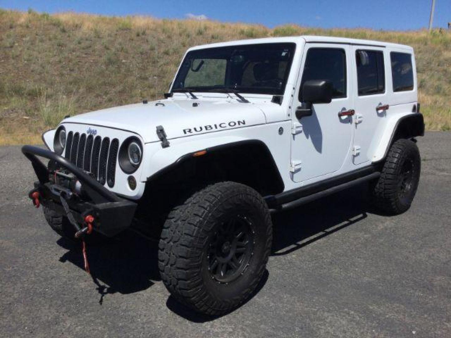 2013 Bright White /Black Cloth Interior Jeep Wrangler Unlimited Rubicon 4WD (1C4BJWFG6DL) with an 3.6L V6 DOHC 24V FFV engine, 5-Speed Automatic transmission, located at 1801 Main Street, Lewiston, 83501, (208) 743-9371, 46.417065, -117.004799 - Photo#0