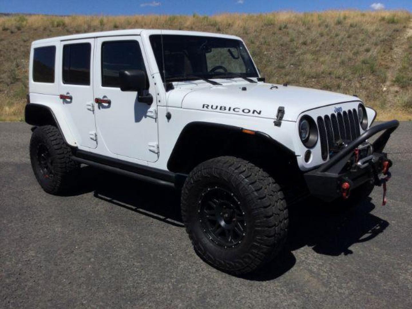 2013 Bright White /Black Cloth Interior Jeep Wrangler Unlimited Rubicon 4WD (1C4BJWFG6DL) with an 3.6L V6 DOHC 24V FFV engine, 5-Speed Automatic transmission, located at 1801 Main Street, Lewiston, 83501, (208) 743-9371, 46.417065, -117.004799 - Photo#8