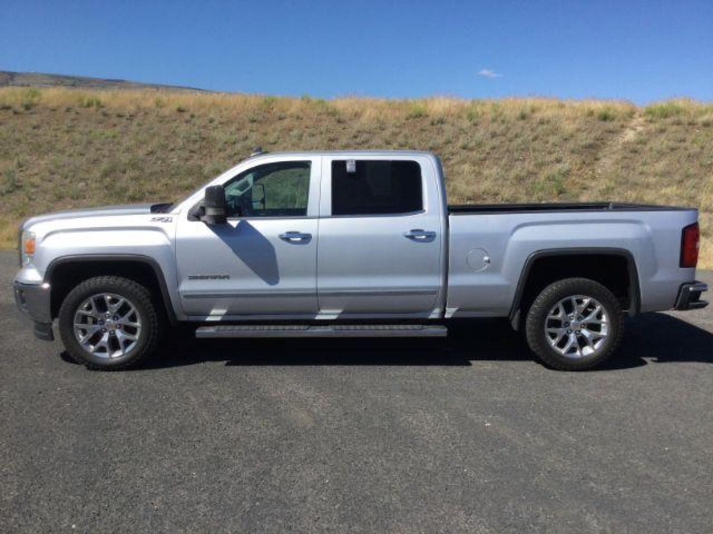 2015 Quicksilver Metallic /Jet Black, leather GMC Sierra 1500 SLT Crew Cab Long Box 4WD (3GTU2VECXFG) with an 5.3L V8 OHV 16V engine, 6-Speed Automatic transmission, located at 1801 Main Street, Lewiston, 83501, (208) 743-9371, 46.417065, -117.004799 - Photo#1