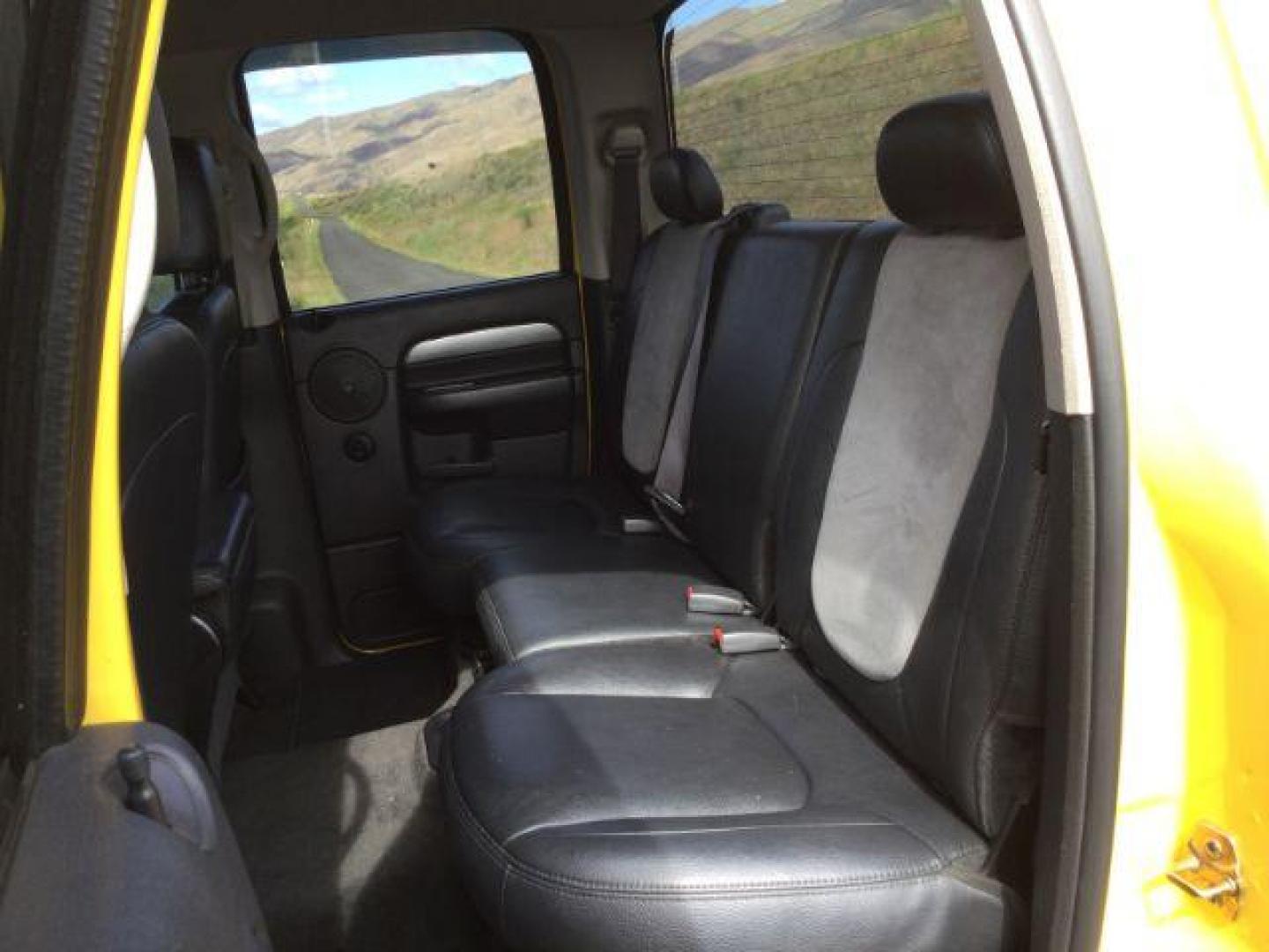 2005 Solar Yellow /Dark Slate Gray Leather Interior Dodge Ram 3500 Laramie Quad Cab Short Bed 4WD (3D7LS38C55G) with an 5.9L L6 OHV 24V TURBO DIESEL engine, 6-Speed Manual transmission, located at 1801 Main Street, Lewiston, 83501, (208) 743-9371, 46.417065, -117.004799 - Photo#9