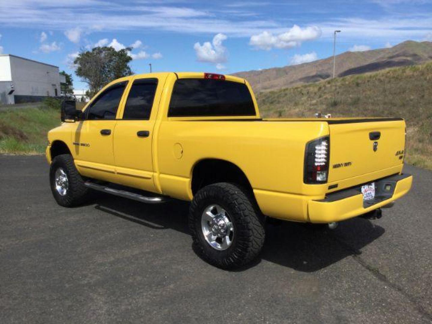 2005 Solar Yellow /Dark Slate Gray Leather Interior Dodge Ram 3500 Laramie Quad Cab Short Bed 4WD (3D7LS38C55G) with an 5.9L L6 OHV 24V TURBO DIESEL engine, 6-Speed Manual transmission, located at 1801 Main Street, Lewiston, 83501, (208) 743-9371, 46.417065, -117.004799 - Photo#10