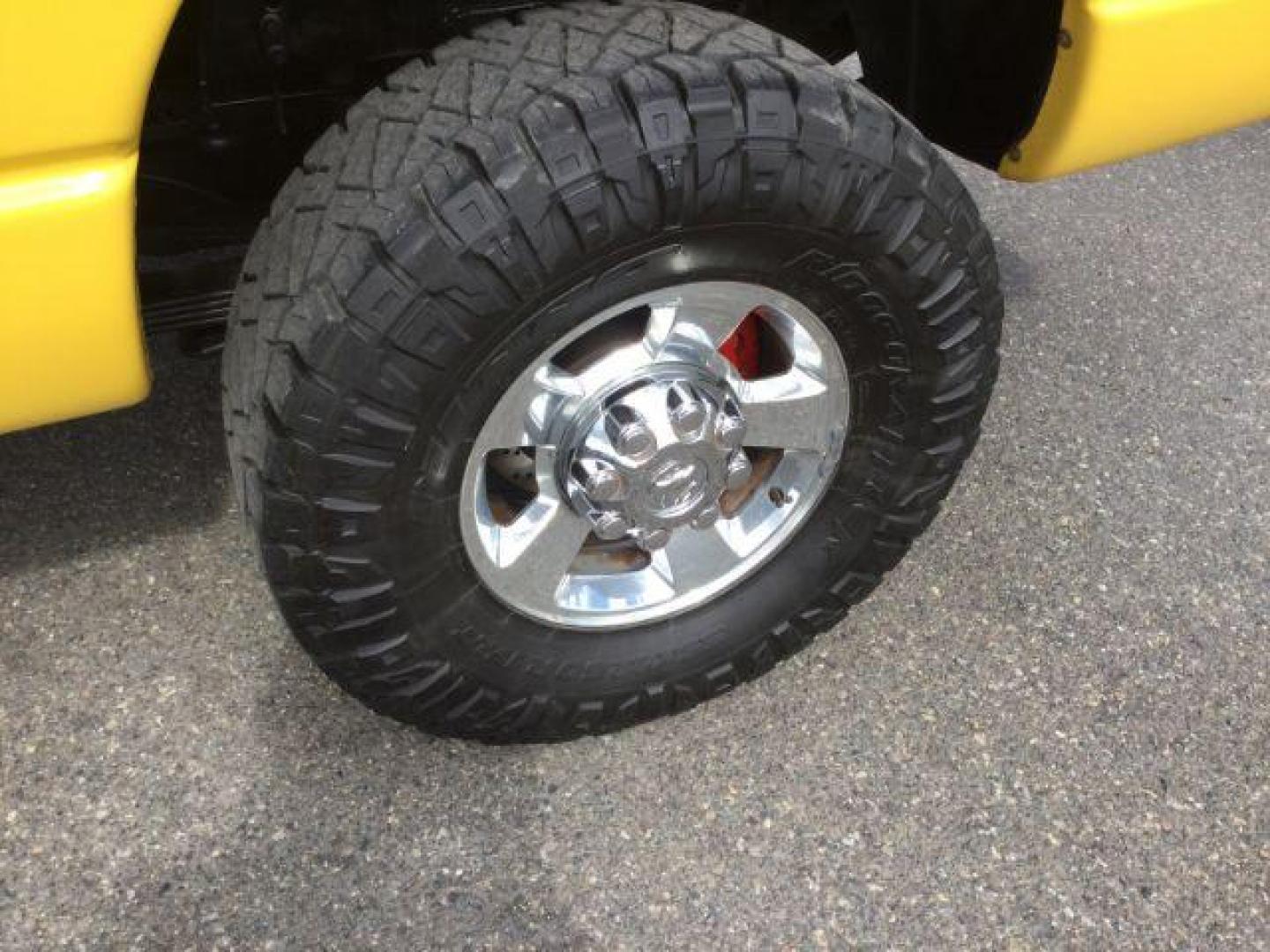 2005 Solar Yellow /Dark Slate Gray Leather Interior Dodge Ram 3500 Laramie Quad Cab Short Bed 4WD (3D7LS38C55G) with an 5.9L L6 OHV 24V TURBO DIESEL engine, 6-Speed Manual transmission, located at 1801 Main Street, Lewiston, 83501, (208) 743-9371, 46.417065, -117.004799 - Photo#13