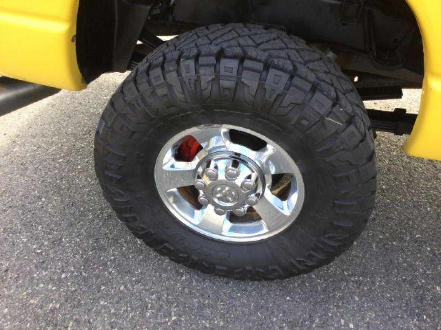 2005 Solar Yellow /Dark Slate Gray Leather Interior Dodge Ram 3500 Laramie Quad Cab Short Bed 4WD (3D7LS38C55G) with an 5.9L L6 OHV 24V TURBO DIESEL engine, 6-Speed Manual transmission, located at 1801 Main Street, Lewiston, 83501, (208) 743-9371, 46.417065, -117.004799 - Photo#16