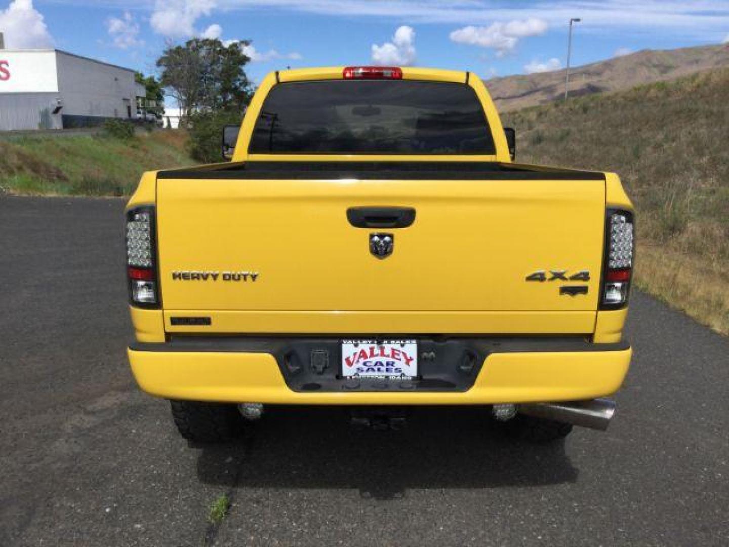 2005 Solar Yellow /Dark Slate Gray Leather Interior Dodge Ram 3500 Laramie Quad Cab Short Bed 4WD (3D7LS38C55G) with an 5.9L L6 OHV 24V TURBO DIESEL engine, 6-Speed Manual transmission, located at 1801 Main Street, Lewiston, 83501, (208) 743-9371, 46.417065, -117.004799 - Photo#17