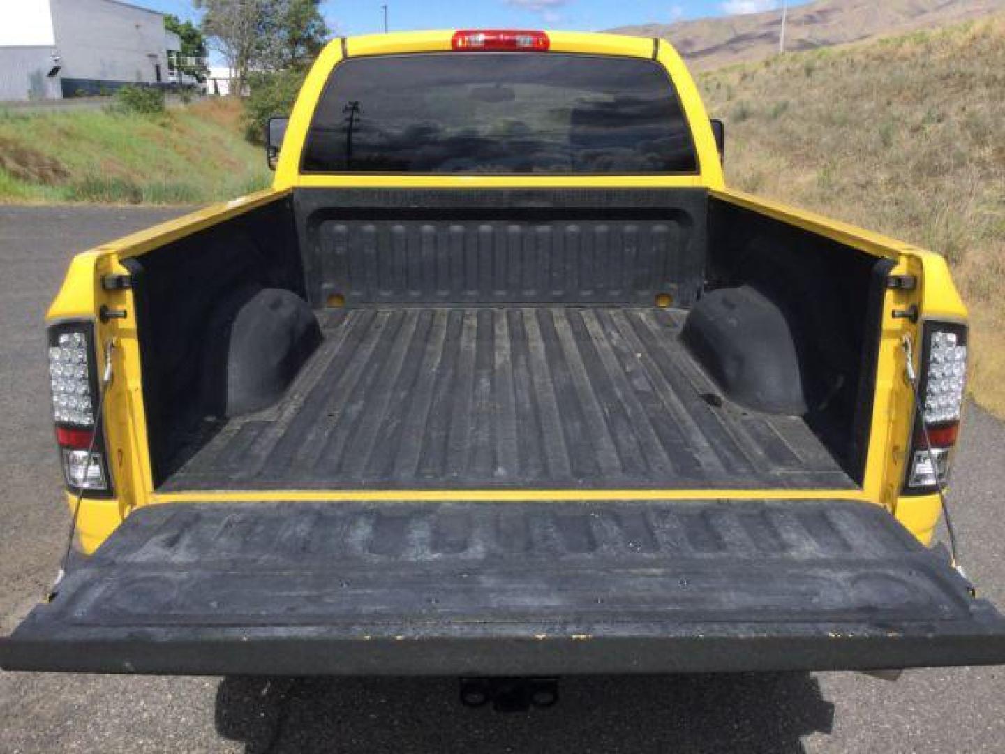 2005 Solar Yellow /Dark Slate Gray Leather Interior Dodge Ram 3500 Laramie Quad Cab Short Bed 4WD (3D7LS38C55G) with an 5.9L L6 OHV 24V TURBO DIESEL engine, 6-Speed Manual transmission, located at 1801 Main Street, Lewiston, 83501, (208) 743-9371, 46.417065, -117.004799 - Photo#19