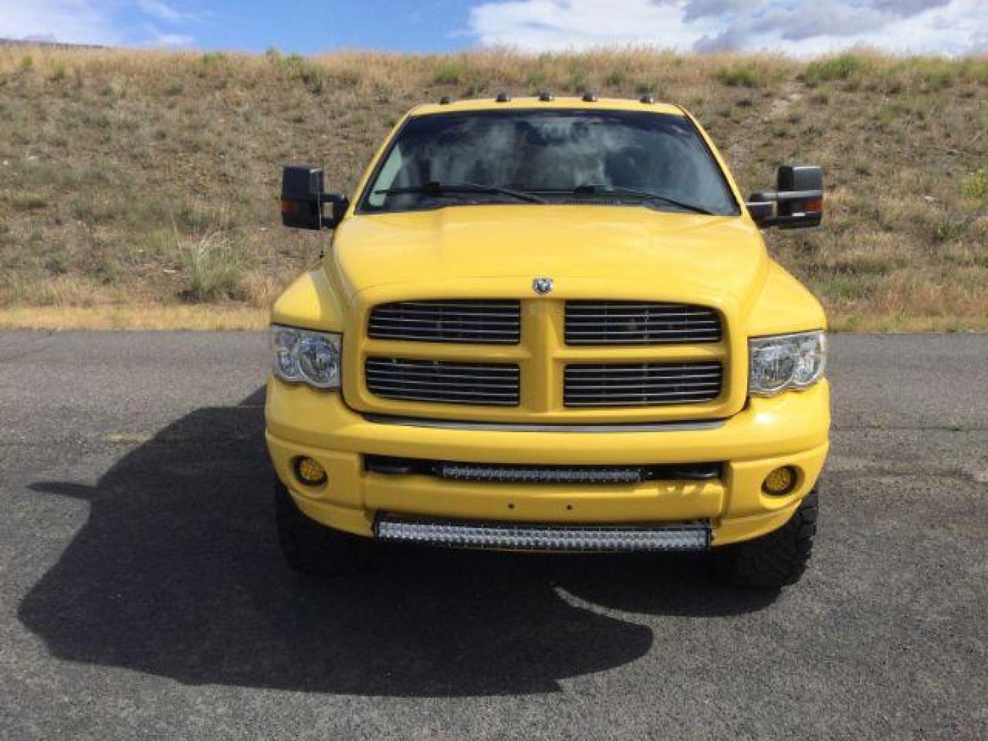 2005 Solar Yellow /Dark Slate Gray Leather Interior Dodge Ram 3500 Laramie Quad Cab Short Bed 4WD (3D7LS38C55G) with an 5.9L L6 OHV 24V TURBO DIESEL engine, 6-Speed Manual transmission, located at 1801 Main Street, Lewiston, 83501, (208) 743-9371, 46.417065, -117.004799 - Photo#3