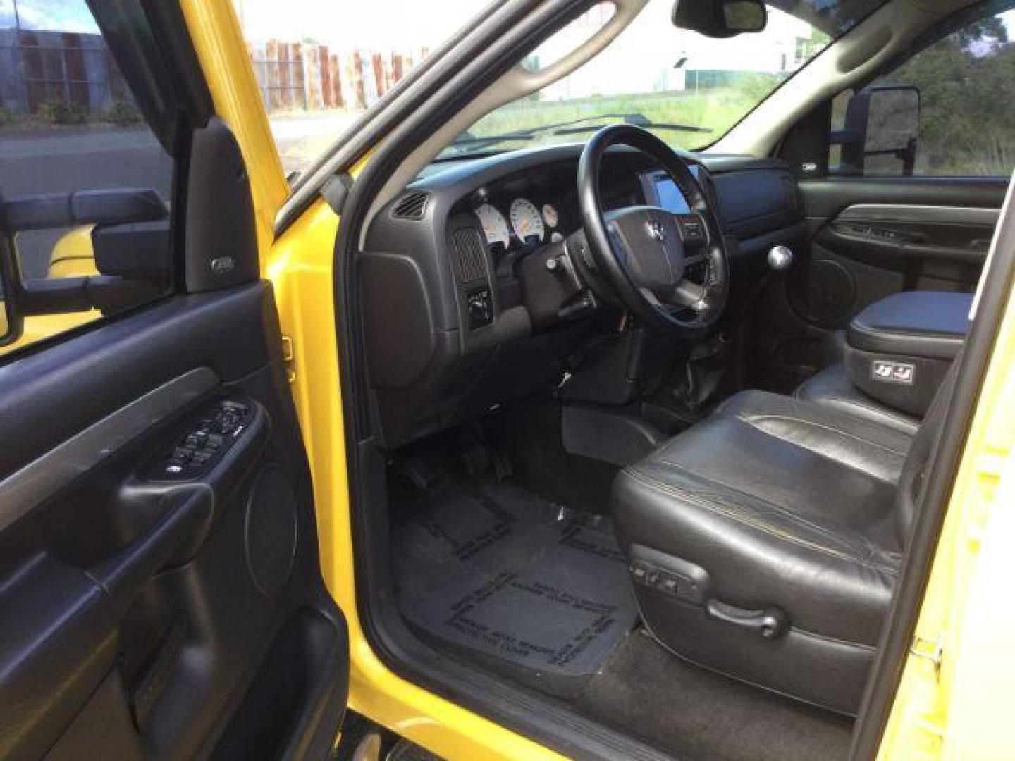 2005 Solar Yellow /Dark Slate Gray Leather Interior Dodge Ram 3500 Laramie Quad Cab Short Bed 4WD (3D7LS38C55G) with an 5.9L L6 OHV 24V TURBO DIESEL engine, 6-Speed Manual transmission, located at 1801 Main Street, Lewiston, 83501, (208) 743-9371, 46.417065, -117.004799 - Photo#5