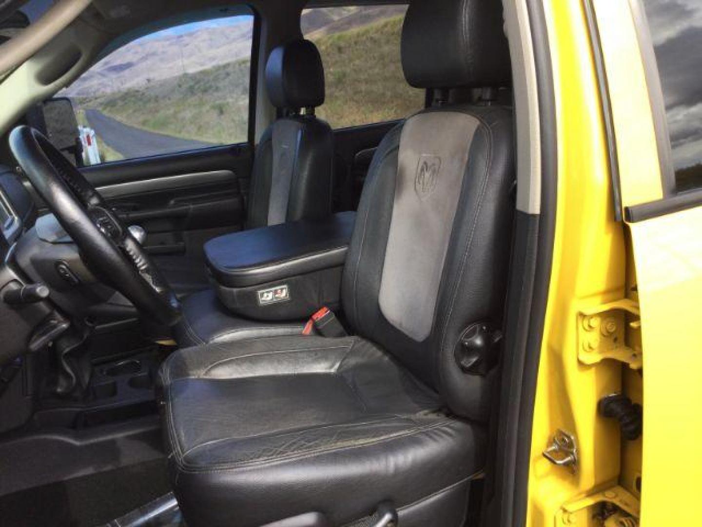 2005 Solar Yellow /Dark Slate Gray Leather Interior Dodge Ram 3500 Laramie Quad Cab Short Bed 4WD (3D7LS38C55G) with an 5.9L L6 OHV 24V TURBO DIESEL engine, 6-Speed Manual transmission, located at 1801 Main Street, Lewiston, 83501, (208) 743-9371, 46.417065, -117.004799 - Photo#7