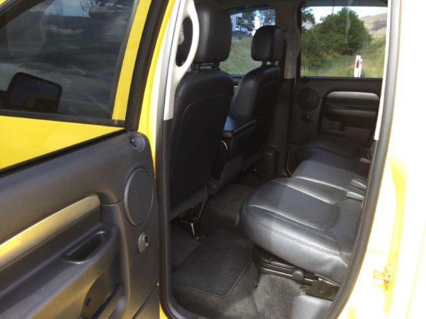 2005 Solar Yellow /Dark Slate Gray Leather Interior Dodge Ram 3500 Laramie Quad Cab Short Bed 4WD (3D7LS38C55G) with an 5.9L L6 OHV 24V TURBO DIESEL engine, 6-Speed Manual transmission, located at 1801 Main Street, Lewiston, 83501, (208) 743-9371, 46.417065, -117.004799 - Photo#8