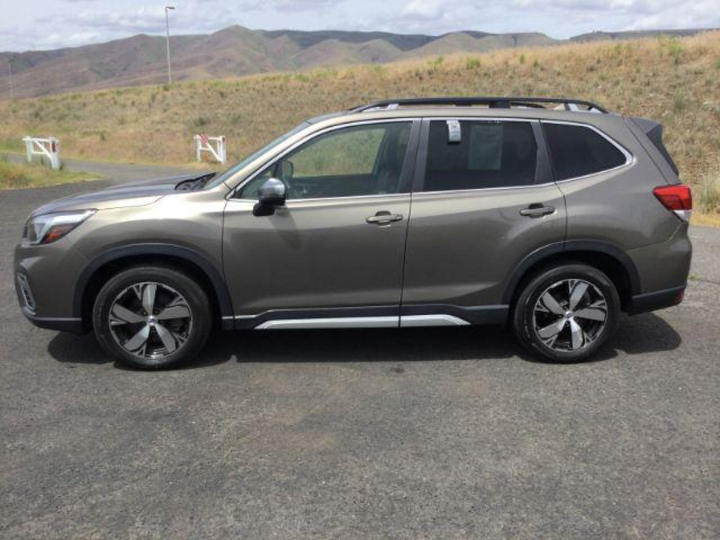 2020 Sepia Bronze Metallic /Saddle Brown, leather Subaru Forester Touring (JF2SKAXC6LH) with an 2.5L H4 SOHC 16V engine, Continuously Variable Transmission transmission, located at 1801 Main Street, Lewiston, 83501, (208) 743-9371, 46.417065, -117.004799 - Photo#1