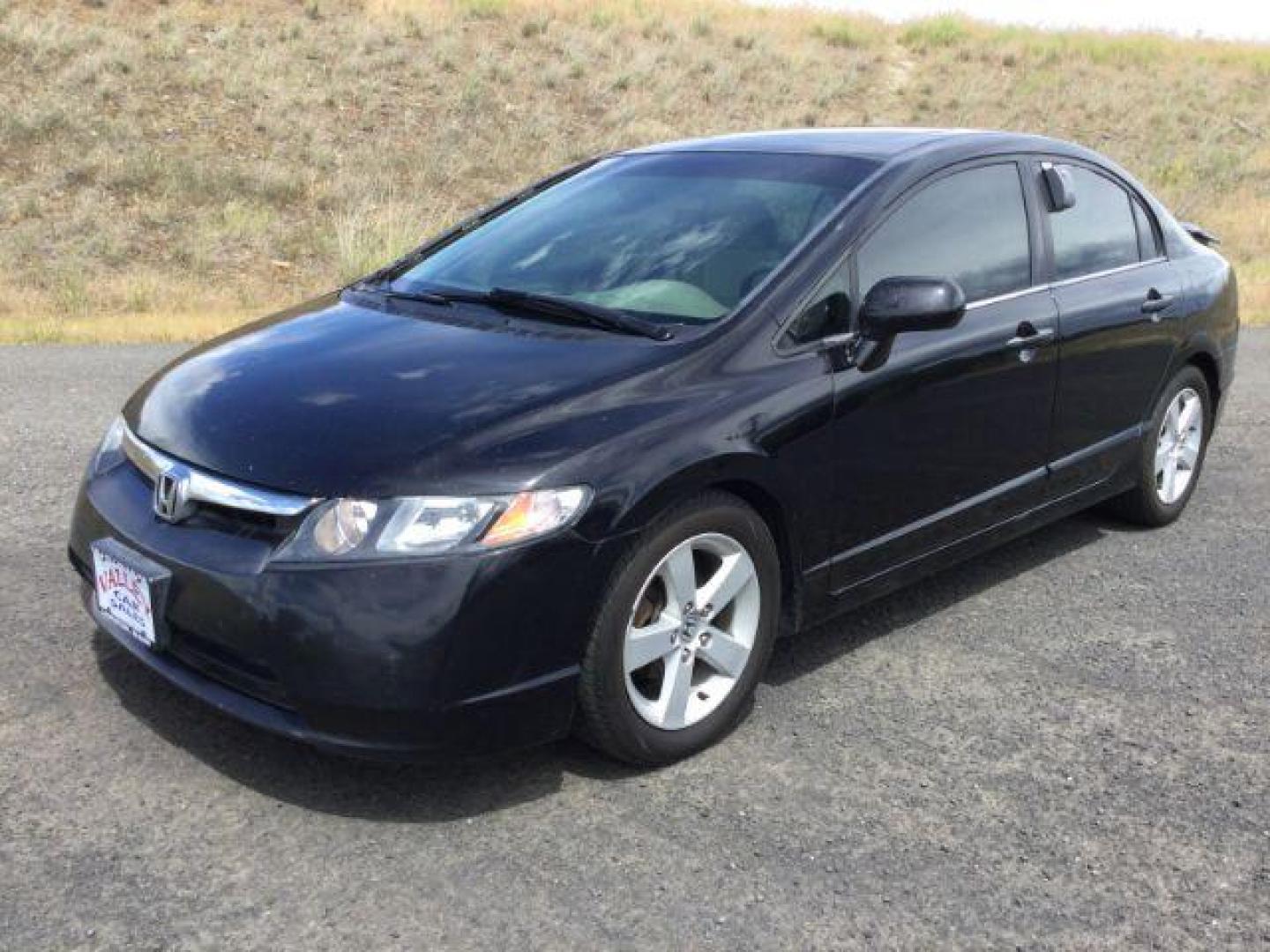 2006 Nighthawk Black Pearl /Ivory Cloth Interior Honda Civic EX Sedan AT (1HGFA16836L) with an 1.8L L4 SOHC 16V engine, 5-Speed Automatic transmission, located at 1801 Main Street, Lewiston, 83501, (208) 743-9371, 46.417065, -117.004799 - Photo#0