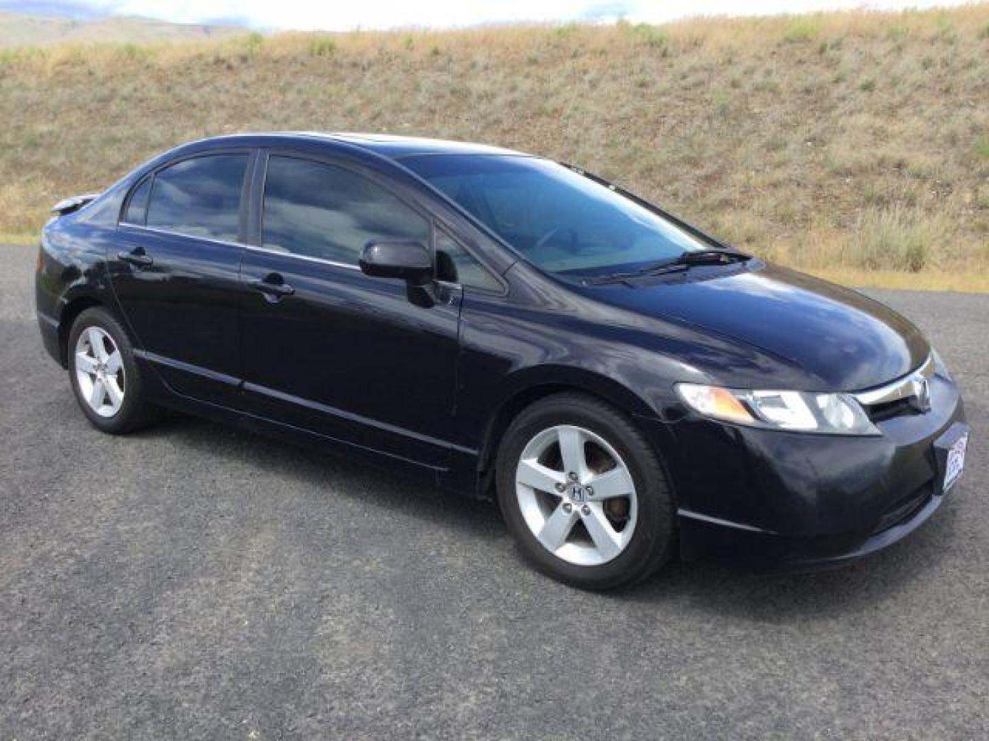 2006 Nighthawk Black Pearl /Ivory Cloth Interior Honda Civic EX Sedan AT (1HGFA16836L) with an 1.8L L4 SOHC 16V engine, 5-Speed Automatic transmission, located at 1801 Main Street, Lewiston, 83501, (208) 743-9371, 46.417065, -117.004799 - Photo#11