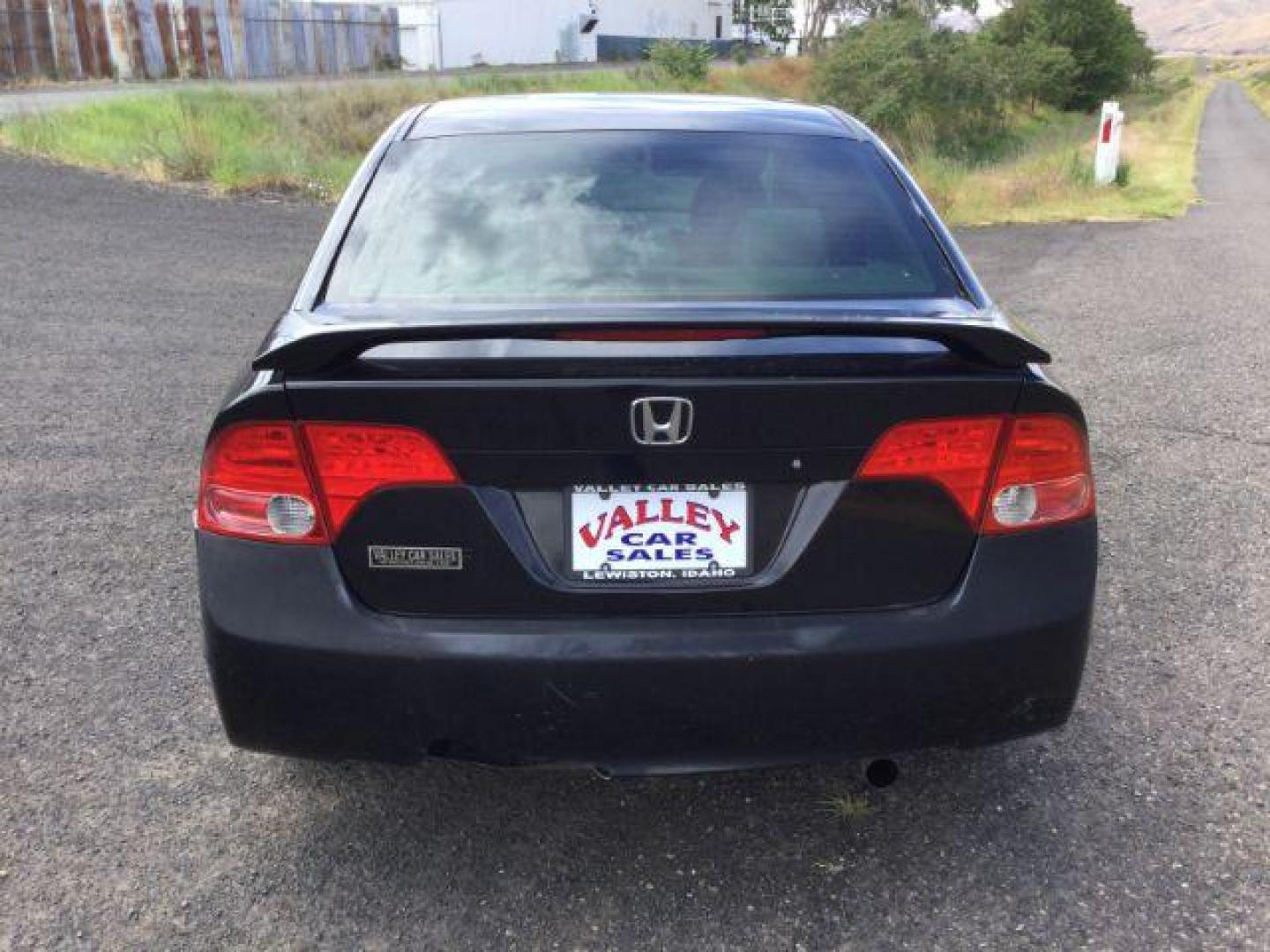 2006 Nighthawk Black Pearl /Ivory Cloth Interior Honda Civic EX Sedan AT (1HGFA16836L) with an 1.8L L4 SOHC 16V engine, 5-Speed Automatic transmission, located at 1801 Main Street, Lewiston, 83501, (208) 743-9371, 46.417065, -117.004799 - Photo#3