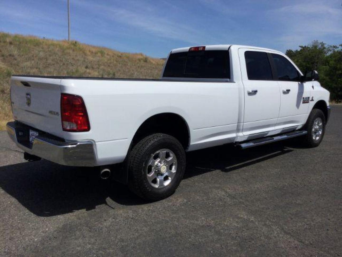 2018 Bright White Clear Coat /BLACK LEATHER RAM 3500 SLT Crew Cab LWB 4WD (3C63R3HL3JG) with an 6.7L L6 OHV 24V TURBO DIESEL engine, 6-Speed Automatic transmission, located at 1801 Main Street, Lewiston, 83501, (208) 743-9371, 46.417065, -117.004799 - Photo#9