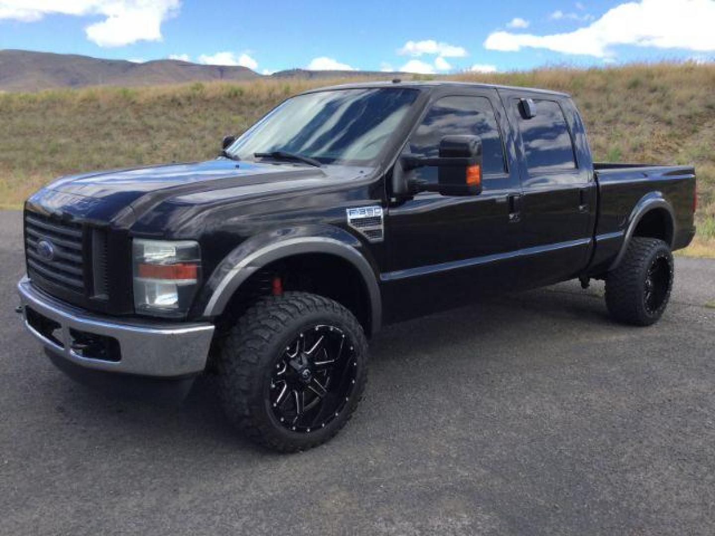 2008 Black /Ebony Leather Interior Ford F-350 SD Lariat Crew Cab 4WD (1FTWW31R28E) with an 6.4L V8 OHV 32V TURBO DIESEL engine, 5-Speed Automatic transmission, located at 1801 Main Street, Lewiston, 83501, (208) 743-9371, 46.417065, -117.004799 - Photo#0