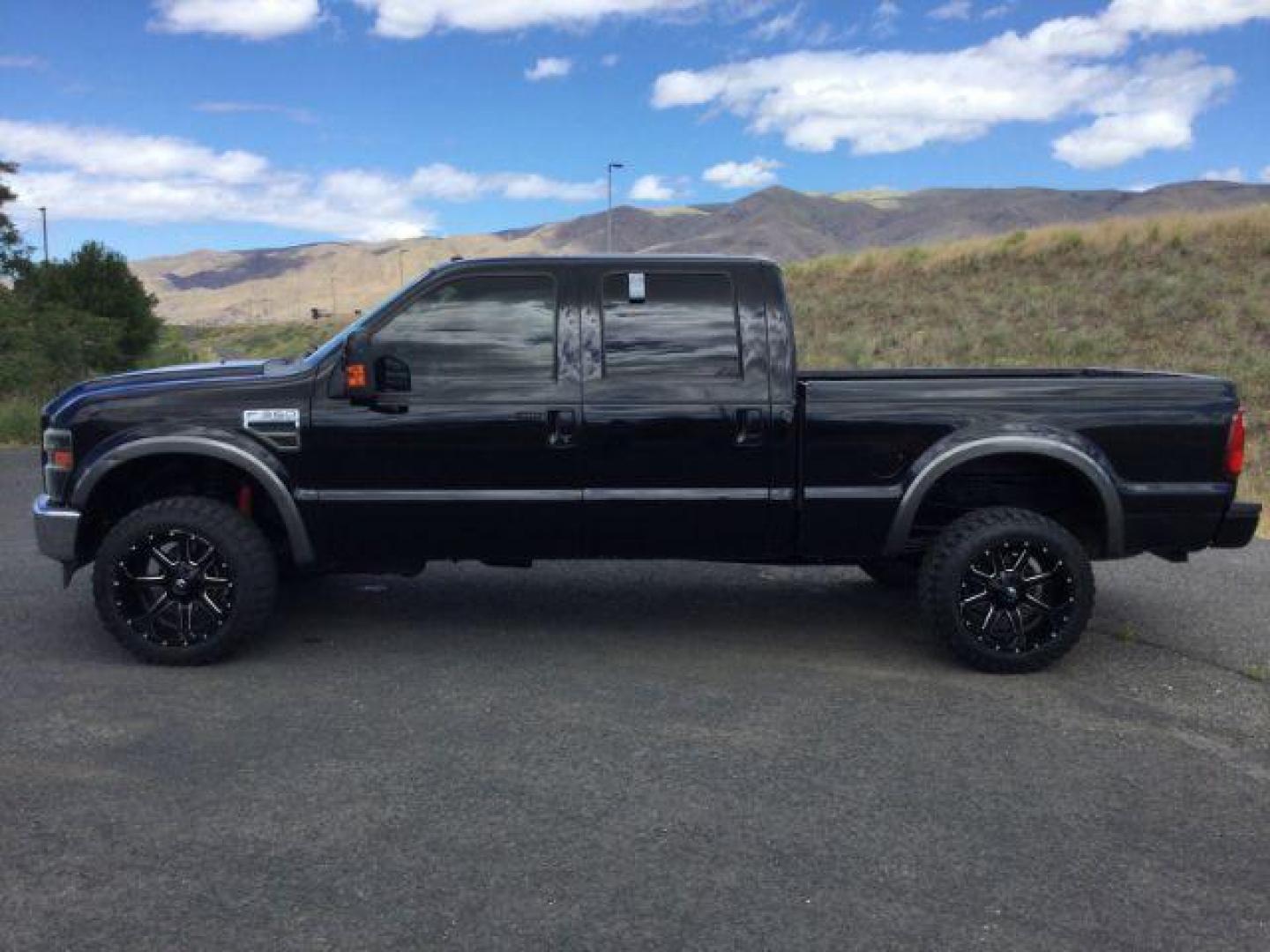 2008 Black /Ebony Leather Interior Ford F-350 SD Lariat Crew Cab 4WD (1FTWW31R28E) with an 6.4L V8 OHV 32V TURBO DIESEL engine, 5-Speed Automatic transmission, located at 1801 Main Street, Lewiston, 83501, (208) 743-9371, 46.417065, -117.004799 - Photo#1