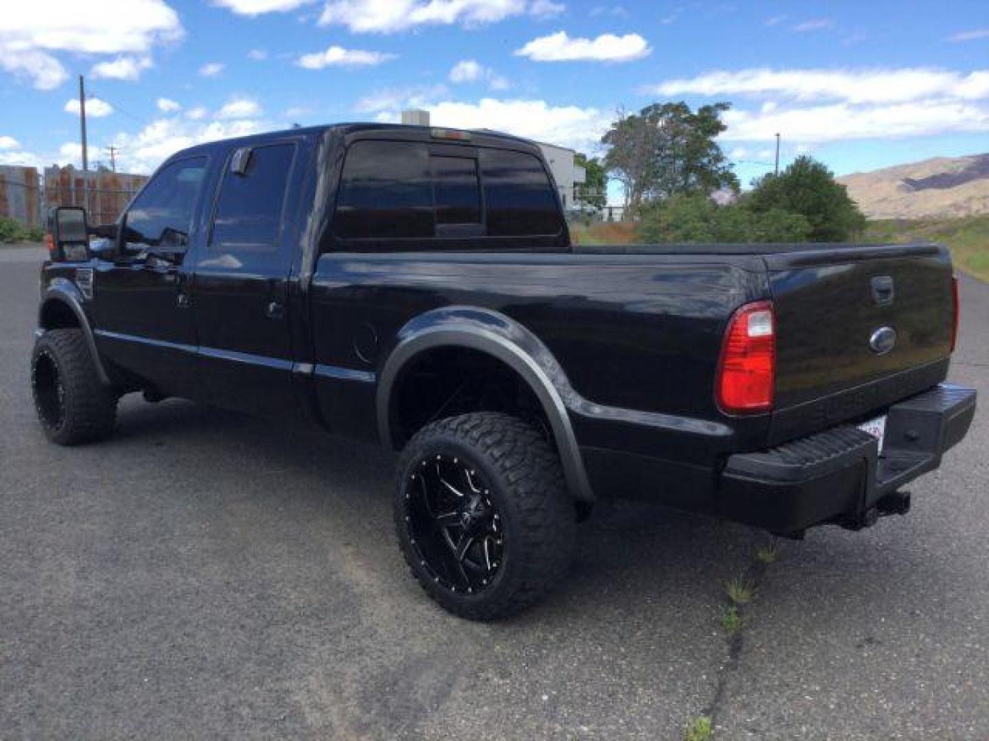 2008 Black /Ebony Leather Interior Ford F-350 SD Lariat Crew Cab 4WD (1FTWW31R28E) with an 6.4L V8 OHV 32V TURBO DIESEL engine, 5-Speed Automatic transmission, located at 1801 Main Street, Lewiston, 83501, (208) 743-9371, 46.417065, -117.004799 - Photo#2