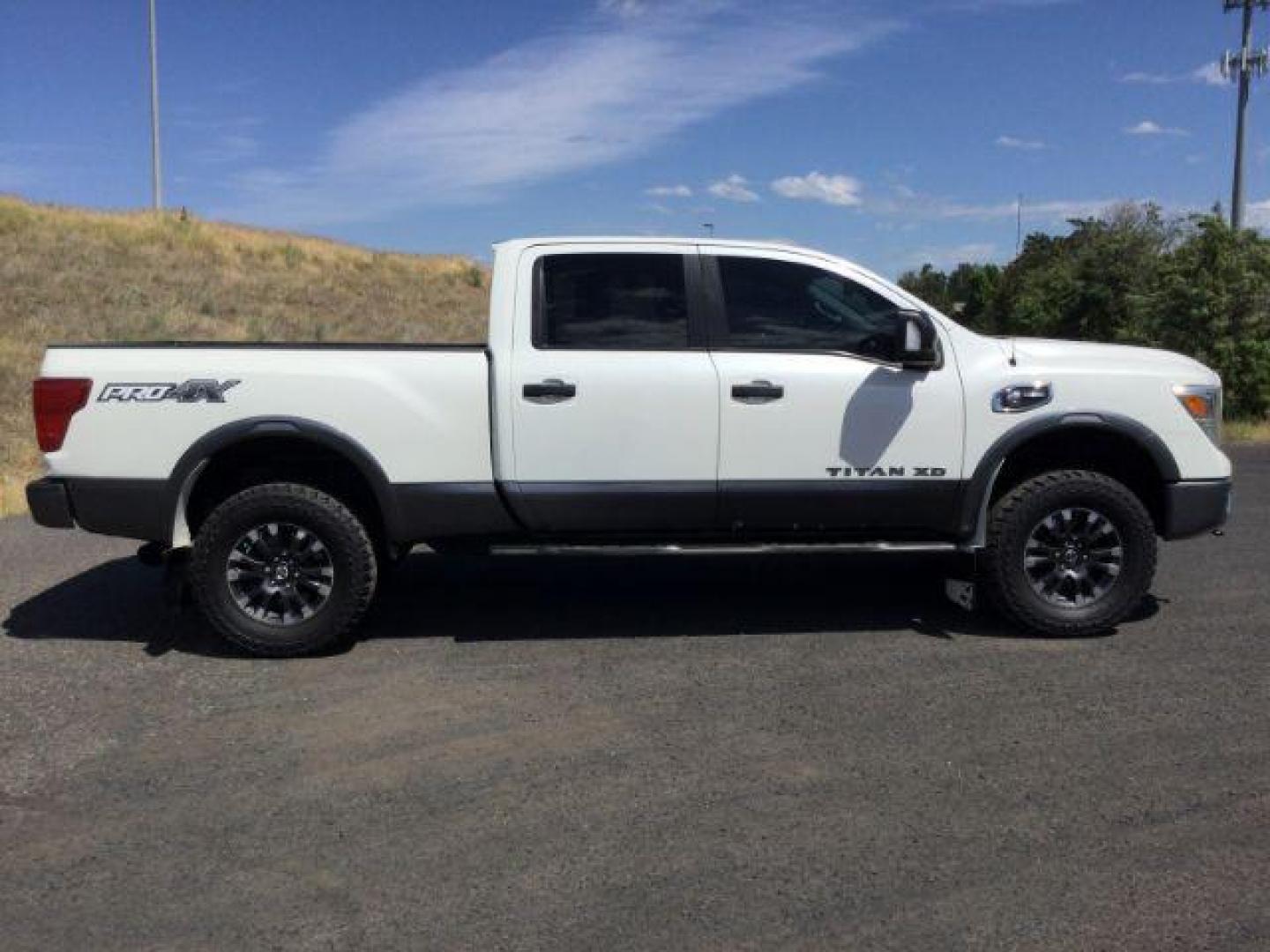 2016 Pearl White /Black, leather Nissan Titan XD PRO-4X 4WD Diesel (1N6BA1F43GN) with an 5.0L V8 DOHC 32V DIESEL engine, 6-Speed Automatic transmission, located at 1801 Main Street, Lewiston, 83501, (208) 743-9371, 46.417065, -117.004799 - Photo#12