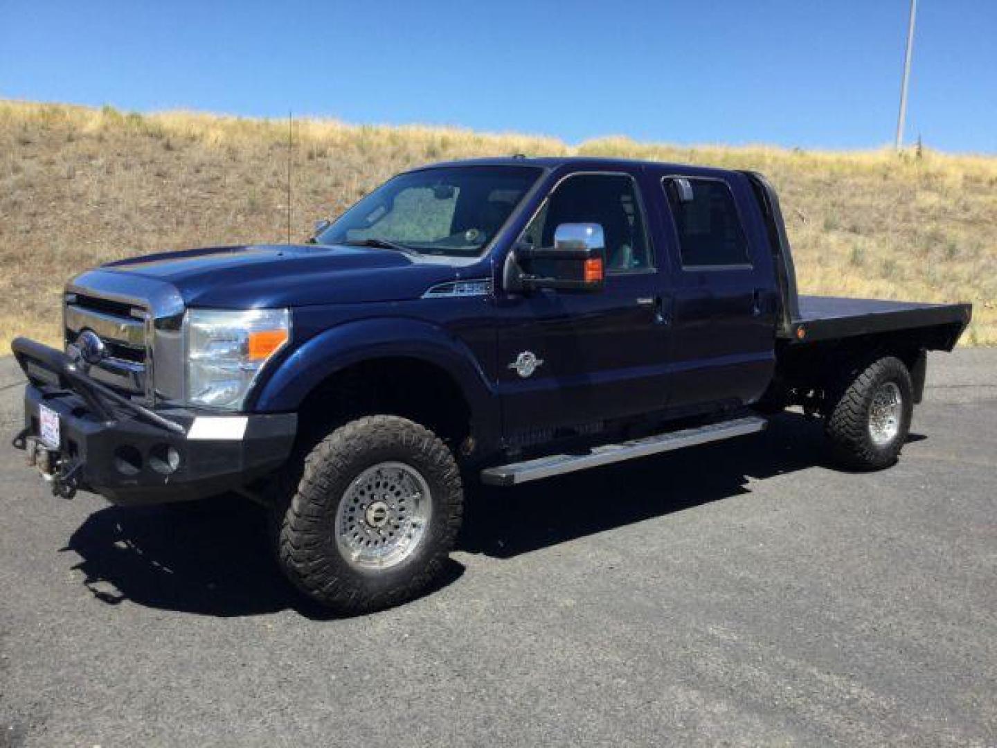 2011 Dark Blue Pearl /Black Leather Interior Ford F-350 SD Lariat Crew Cab Long Bed 4WD (1FT8W3BT8BE) with an 6.7L V8 OHV 16V DIESEL engine, 6-Speed Automatic transmission, located at 1801 Main Street, Lewiston, 83501, (208) 743-9371, 46.417065, -117.004799 - Photo#0