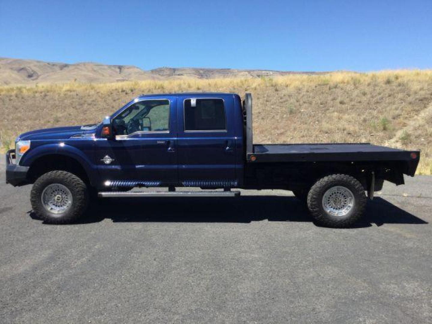 2011 Dark Blue Pearl /Black Leather Interior Ford F-350 SD Lariat Crew Cab Long Bed 4WD (1FT8W3BT8BE) with an 6.7L V8 OHV 16V DIESEL engine, 6-Speed Automatic transmission, located at 1801 Main Street, Lewiston, 83501, (208) 743-9371, 46.417065, -117.004799 - Photo#1