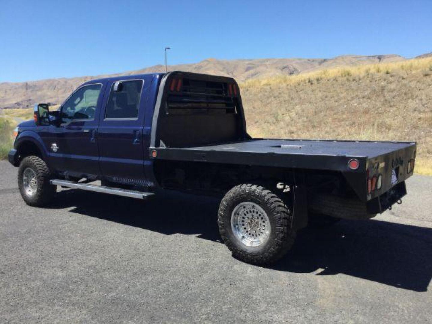 2011 Dark Blue Pearl /Black Leather Interior Ford F-350 SD Lariat Crew Cab Long Bed 4WD (1FT8W3BT8BE) with an 6.7L V8 OHV 16V DIESEL engine, 6-Speed Automatic transmission, located at 1801 Main Street, Lewiston, 83501, (208) 743-9371, 46.417065, -117.004799 - Photo#2