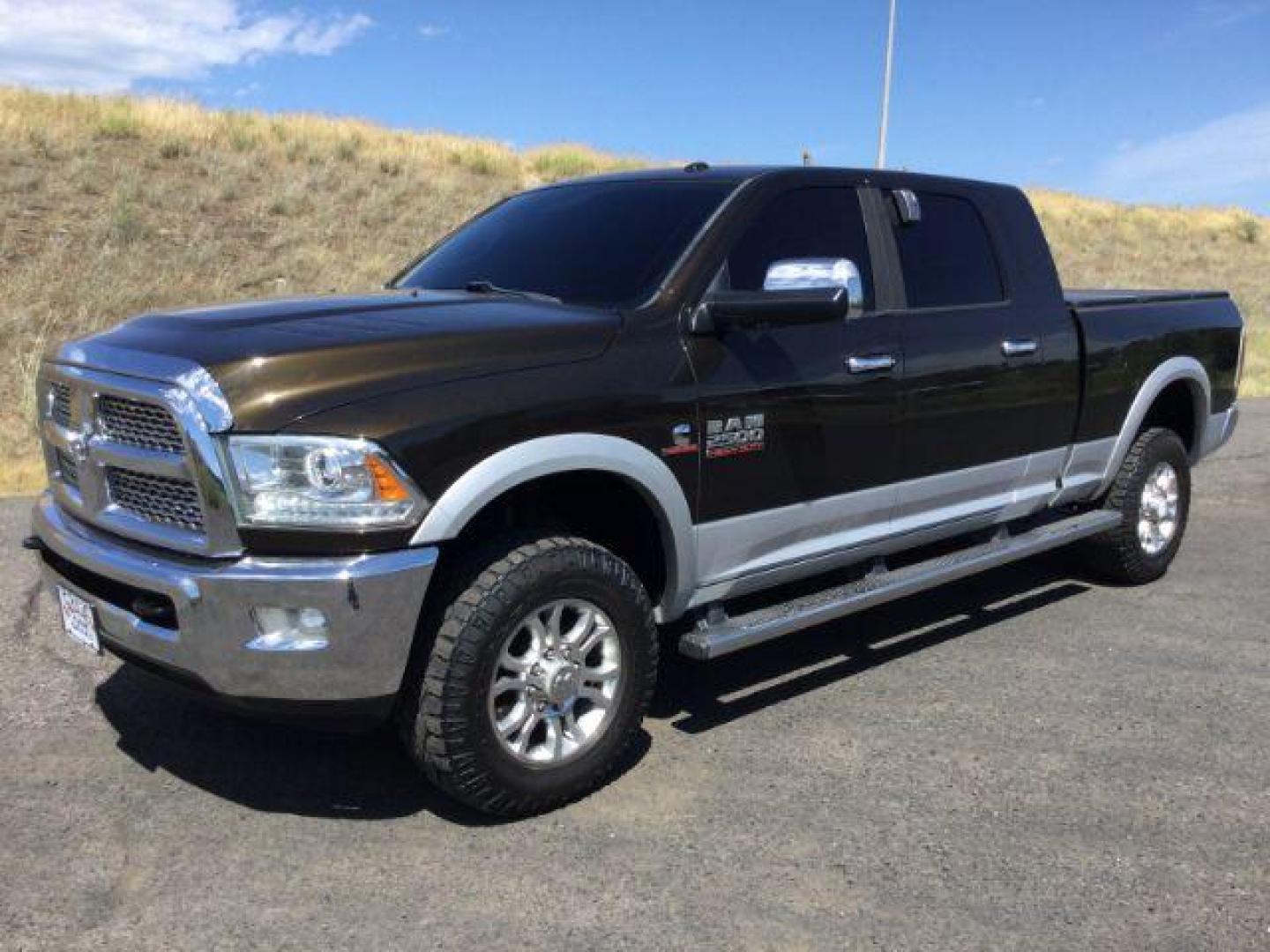 2014 Black Gold Pearlcoat /Black RAM 2500 Laramie Mega Cab 4WD (3C6UR5NL4EG) with an 6.7L L6 OHV 24V TURBO DIESEL engine, 6-Speed Automatic transmission, located at 1801 Main Street, Lewiston, 83501, (208) 743-9371, 46.417065, -117.004799 - Photo#0