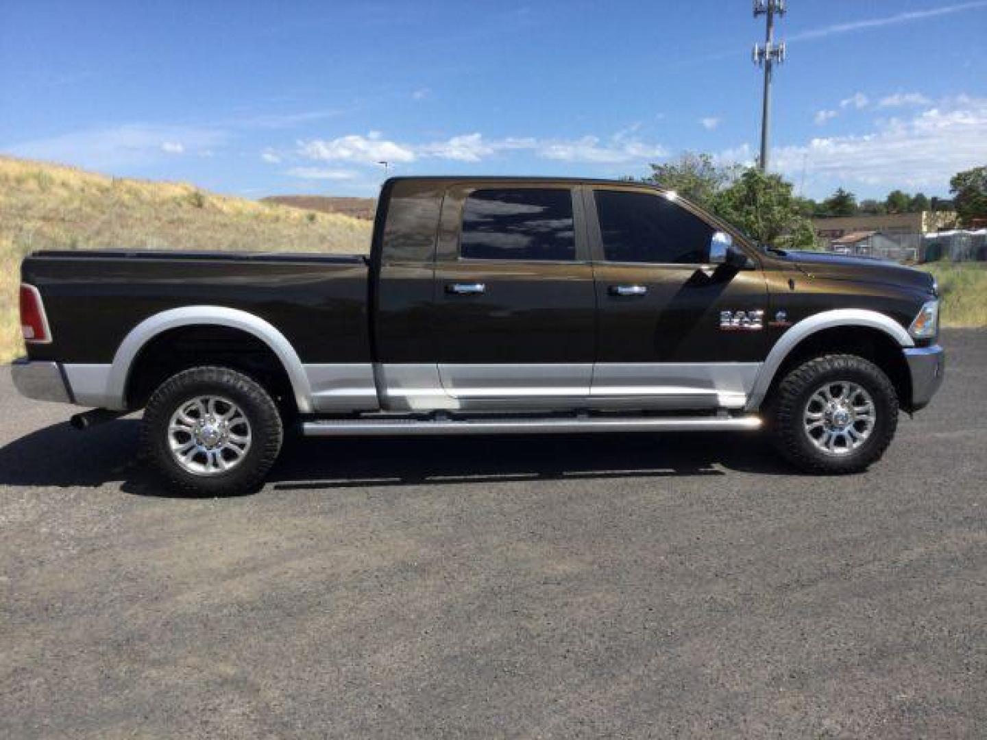 2014 Black Gold Pearlcoat /Black RAM 2500 Laramie Mega Cab 4WD (3C6UR5NL4EG) with an 6.7L L6 OHV 24V TURBO DIESEL engine, 6-Speed Automatic transmission, located at 1801 Main Street, Lewiston, 83501, (208) 743-9371, 46.417065, -117.004799 - Photo#11