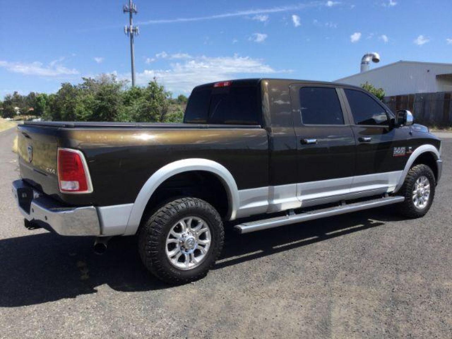 2014 Black Gold Pearlcoat /Black RAM 2500 Laramie Mega Cab 4WD (3C6UR5NL4EG) with an 6.7L L6 OHV 24V TURBO DIESEL engine, 6-Speed Automatic transmission, located at 1801 Main Street, Lewiston, 83501, (208) 743-9371, 46.417065, -117.004799 - Photo#12