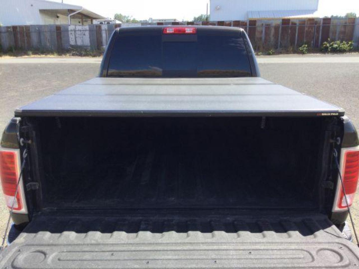 2014 Black Gold Pearlcoat /Black RAM 2500 Laramie Mega Cab 4WD (3C6UR5NL4EG) with an 6.7L L6 OHV 24V TURBO DIESEL engine, 6-Speed Automatic transmission, located at 1801 Main Street, Lewiston, 83501, (208) 743-9371, 46.417065, -117.004799 - Photo#16