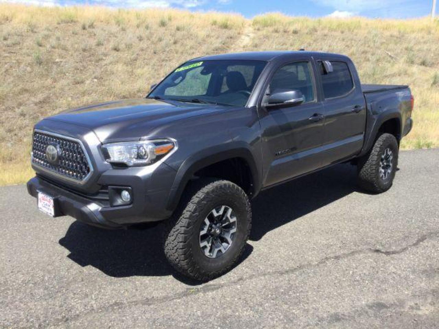 2019 Magnetic Gray Metallic /Black w/Caramel Accent Stitching, cloth Toyota Tacoma SR5 Double Cab Long Bed V6 6AT 4WD (5TFCZ5AN2KX) with an 3.5L V6 DOHC 24V engine, 6-Speed Manual Transmission transmission, located at 1801 Main Street, Lewiston, 83501, (208) 743-9371, 46.417065, -117.004799 - Photo#0