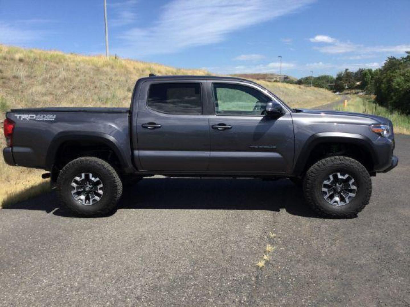 2019 Magnetic Gray Metallic /Black w/Caramel Accent Stitching, cloth Toyota Tacoma SR5 Double Cab Long Bed V6 6AT 4WD (5TFCZ5AN2KX) with an 3.5L V6 DOHC 24V engine, 6-Speed Manual Transmission transmission, located at 1801 Main Street, Lewiston, 83501, (208) 743-9371, 46.417065, -117.004799 - Photo#16