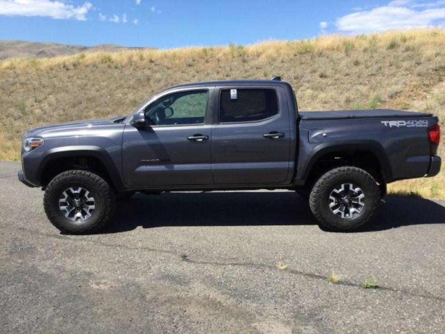 2019 Magnetic Gray Metallic /Black w/Caramel Accent Stitching, cloth Toyota Tacoma SR5 Double Cab Long Bed V6 6AT 4WD (5TFCZ5AN2KX) with an 3.5L V6 DOHC 24V engine, 6-Speed Manual Transmission transmission, located at 1801 Main Street, Lewiston, 83501, (208) 743-9371, 46.417065, -117.004799 - Photo#1