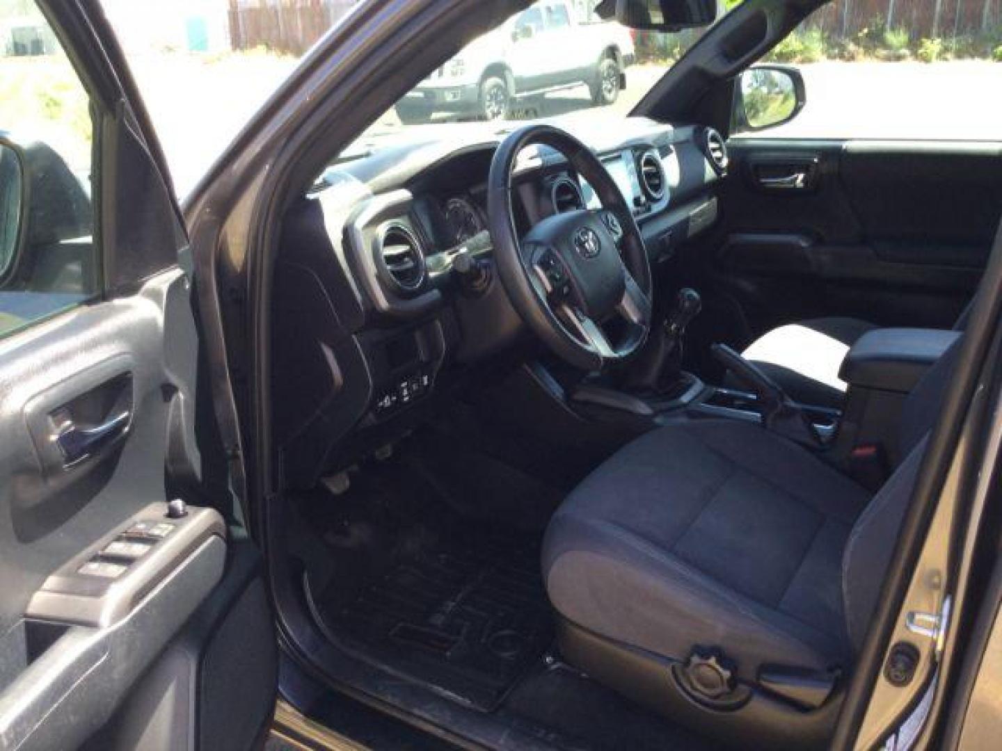 2019 Magnetic Gray Metallic /Black w/Caramel Accent Stitching, cloth Toyota Tacoma SR5 Double Cab Long Bed V6 6AT 4WD (5TFCZ5AN2KX) with an 3.5L V6 DOHC 24V engine, 6-Speed Manual Transmission transmission, located at 1801 Main Street, Lewiston, 83501, (208) 743-9371, 46.417065, -117.004799 - Photo#4