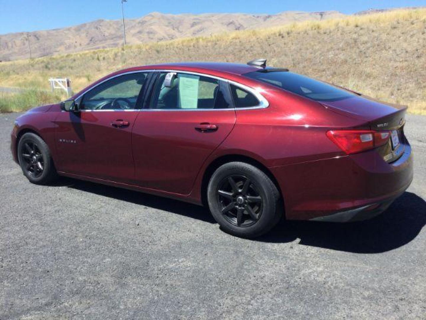 2016 Crystal Red Tintcoat /BLACK CLOTH Chevrolet Malibu LS (1G1ZB5ST5GF) with an 1.5L L4 DOHC 16V engine, 6-Speed Automatic transmission, located at 1801 Main Street, Lewiston, 83501, (208) 743-9371, 46.417065, -117.004799 - Photo#2