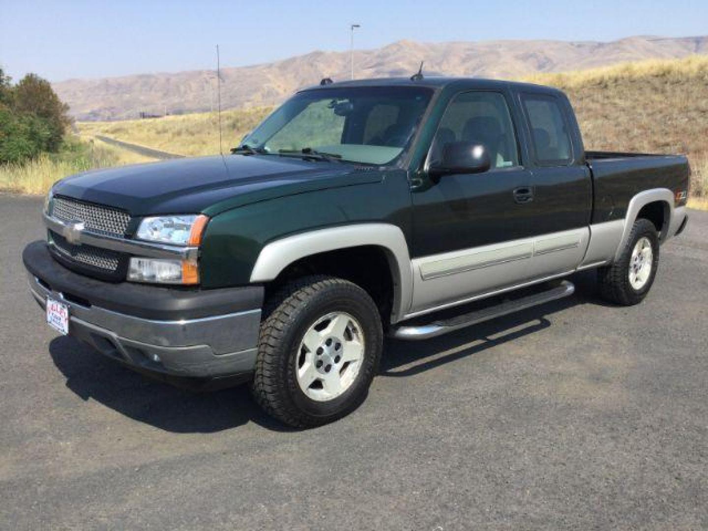 2005 Dark Green Metallic /Tan Leather Interior Chevrolet Silverado 1500 LT Ext. Cab Short Bed 4WD (1GCEK19B15Z) with an 5.3L V8 OHV 16V engine, 4-Speed Automatic transmission, located at 1801 Main Street, Lewiston, 83501, (208) 743-9371, 46.417065, -117.004799 - Photo#0