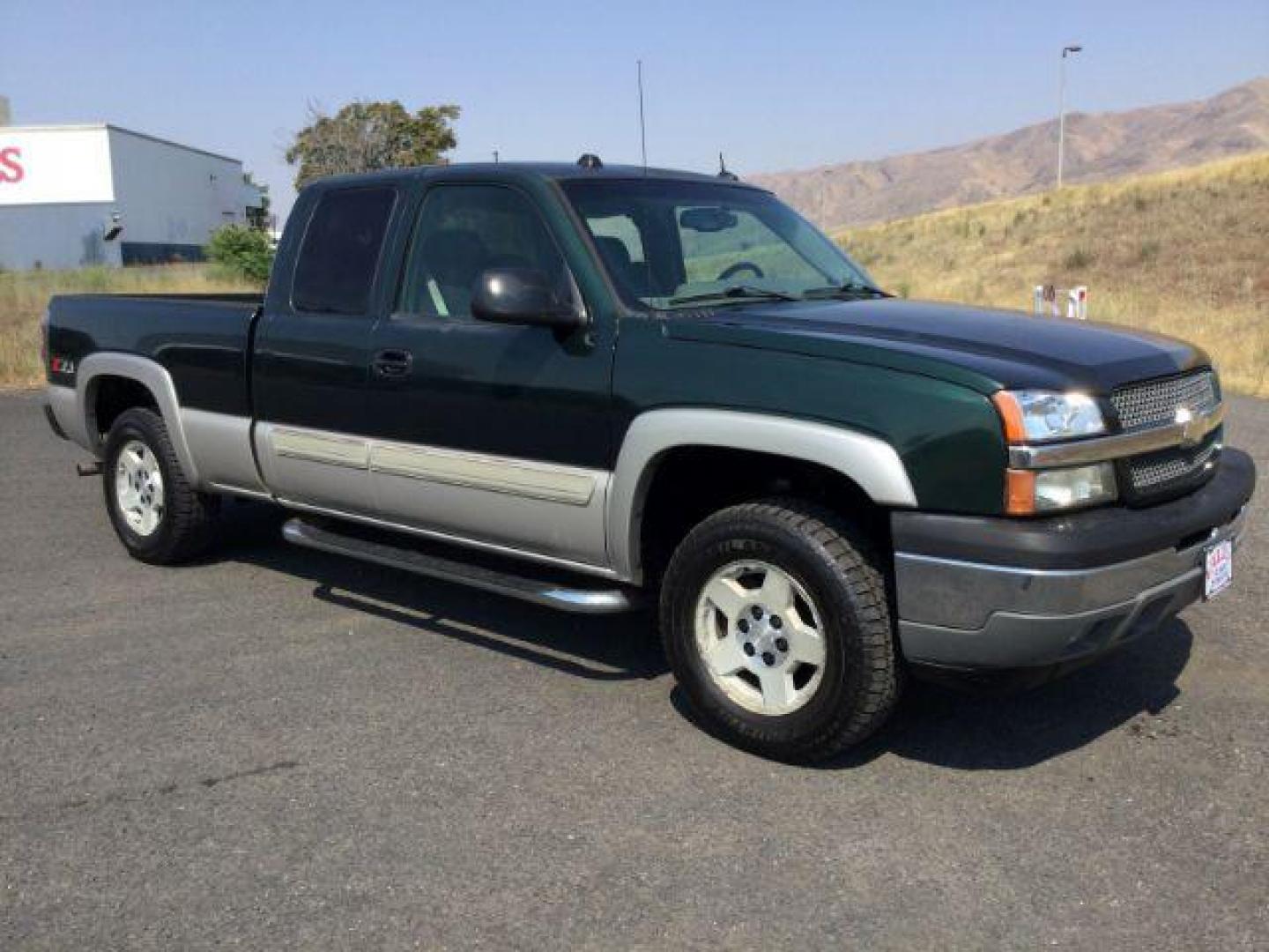 2005 Dark Green Metallic /Tan Leather Interior Chevrolet Silverado 1500 LT Ext. Cab Short Bed 4WD (1GCEK19B15Z) with an 5.3L V8 OHV 16V engine, 4-Speed Automatic transmission, located at 1801 Main Street, Lewiston, 83501, (208) 743-9371, 46.417065, -117.004799 - Photo#9