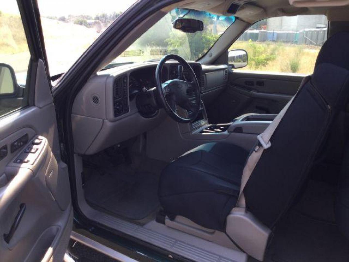 2005 Dark Green Metallic /Tan Leather Interior Chevrolet Silverado 1500 LT Ext. Cab Short Bed 4WD (1GCEK19B15Z) with an 5.3L V8 OHV 16V engine, 4-Speed Automatic transmission, located at 1801 Main Street, Lewiston, 83501, (208) 743-9371, 46.417065, -117.004799 - Photo#4