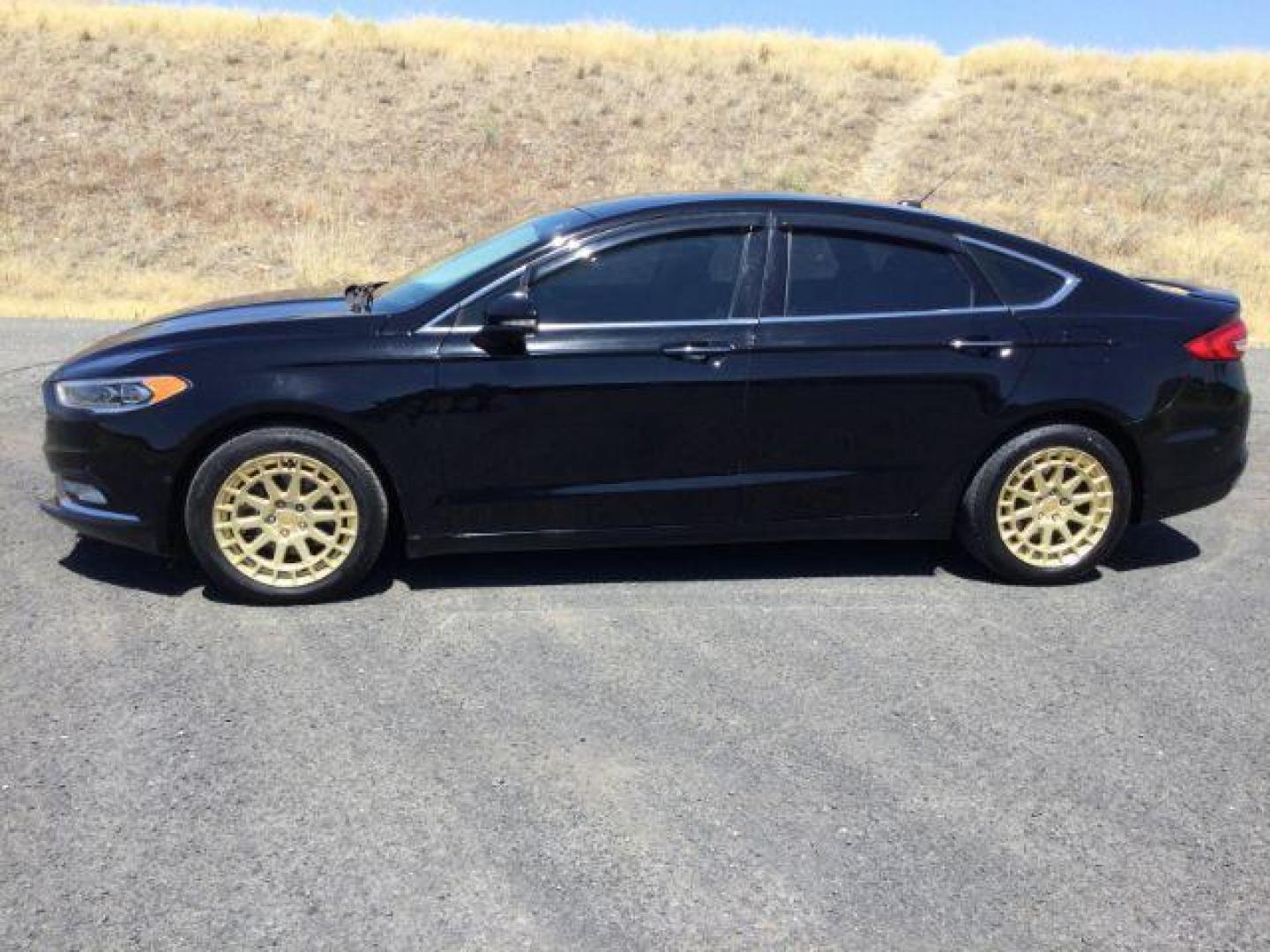 2017 Shadow Black /Ebony, premium leather Ford Fusion Titanium AWD (3FA6P0D94HR) with an 2.0L L4 DOHC 16V engine, 6-Speed Automatic transmission, located at 1801 Main Street, Lewiston, 83501, (208) 743-9371, 46.417065, -117.004799 - Photo#1