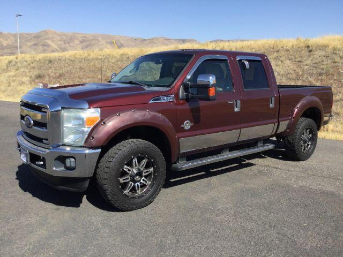 2011 Royal Red Metallic /Adobe Cloth Interior Ford F-350 SD XLT Crew Cab 4WD (1FT8W3BT8BE) with an 6.7L V8 OHV 16V DIESEL engine, 6-Speed Automatic transmission, located at 1801 Main Street, Lewiston, 83501, (208) 743-9371, 46.417065, -117.004799 - Photo#0