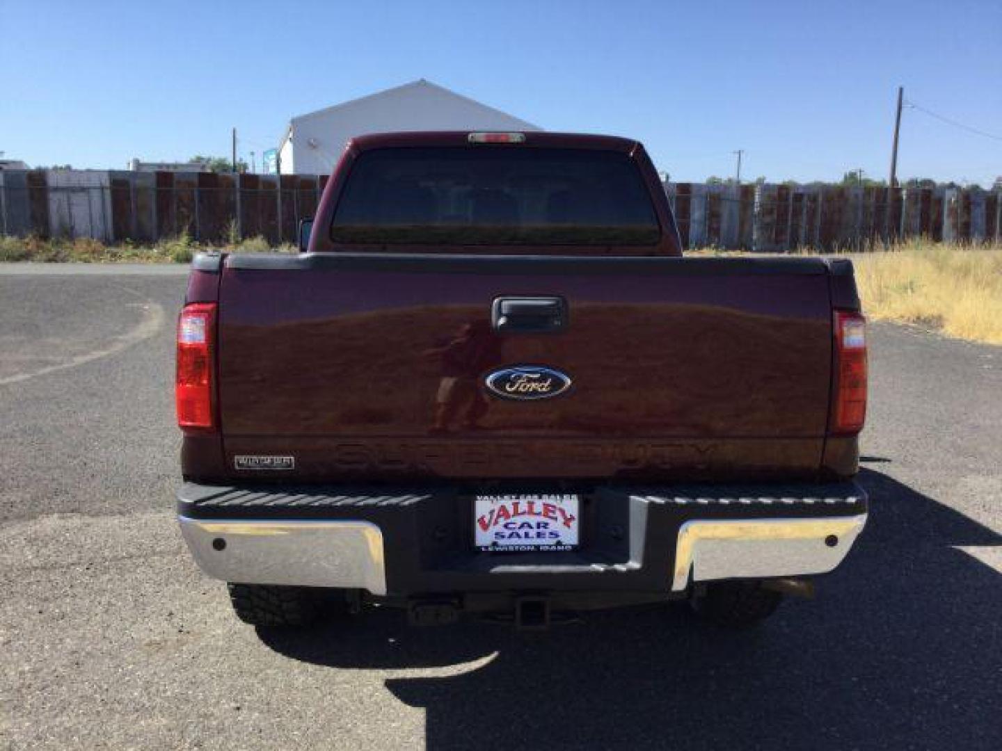 2011 Royal Red Metallic /Adobe Cloth Interior Ford F-350 SD XLT Crew Cab 4WD (1FT8W3BT8BE) with an 6.7L V8 OHV 16V DIESEL engine, 6-Speed Automatic transmission, located at 1801 Main Street, Lewiston, 83501, (208) 743-9371, 46.417065, -117.004799 - Photo#12