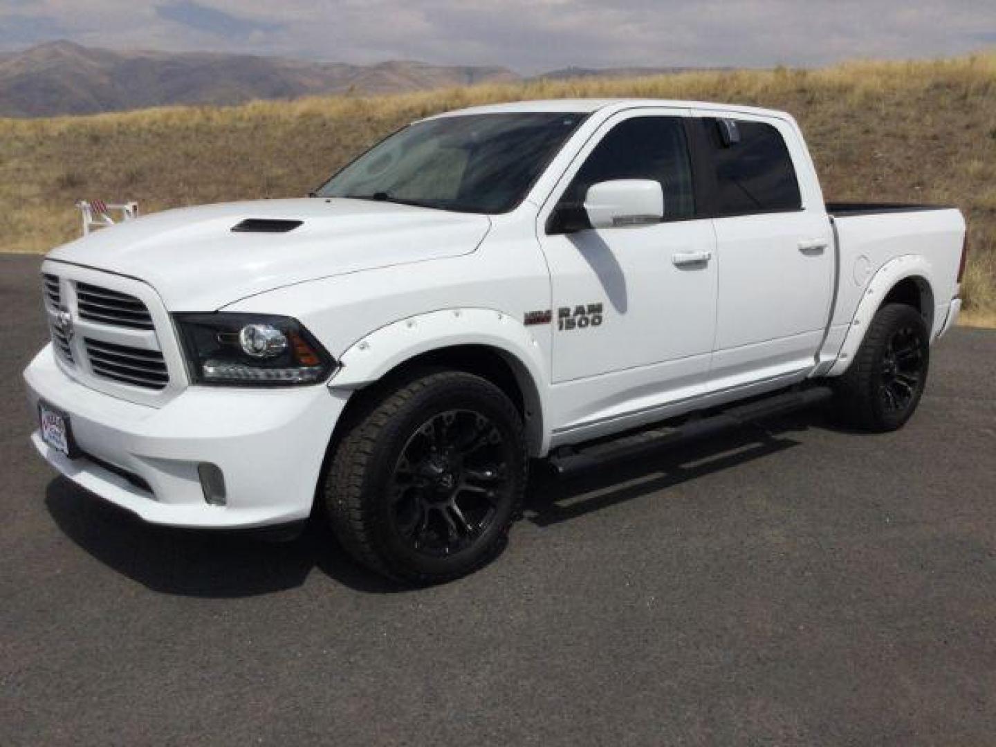 2016 Bright White Clear Coat /Black, leather RAM 1500 Sport Crew Cab SWB 4WD (1C6RR7MT2GS) with an 5.7L V8 OHV 16V engine, 8-Speed Automatic transmission, located at 1801 Main Street, Lewiston, 83501, (208) 743-9371, 46.417065, -117.004799 - Photo#0