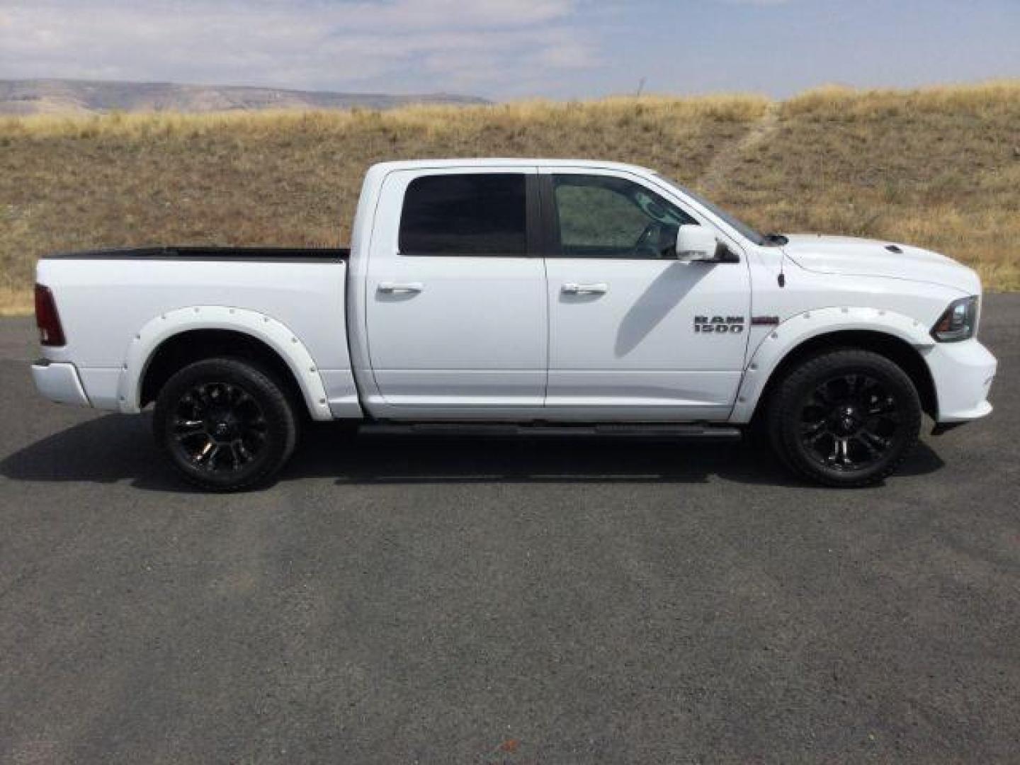 2016 Bright White Clear Coat /Black, leather RAM 1500 Sport Crew Cab SWB 4WD (1C6RR7MT2GS) with an 5.7L V8 OHV 16V engine, 8-Speed Automatic transmission, located at 1801 Main Street, Lewiston, 83501, (208) 743-9371, 46.417065, -117.004799 - Photo#9