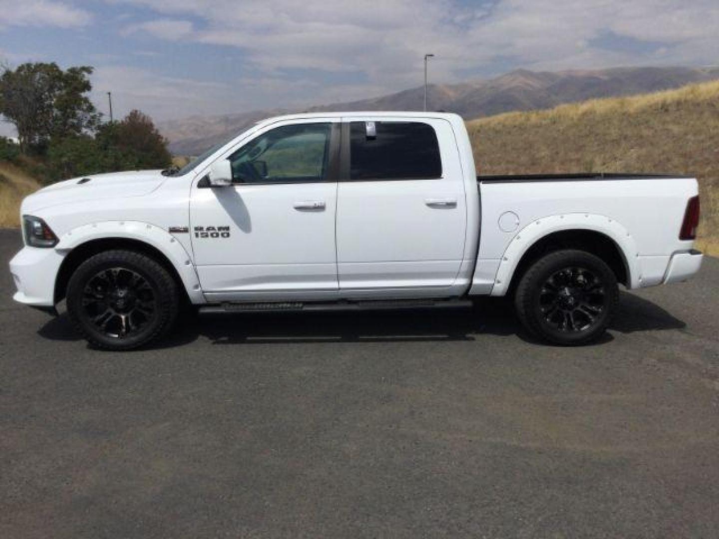 2016 Bright White Clear Coat /Black, leather RAM 1500 Sport Crew Cab SWB 4WD (1C6RR7MT2GS) with an 5.7L V8 OHV 16V engine, 8-Speed Automatic transmission, located at 1801 Main Street, Lewiston, 83501, (208) 743-9371, 46.417065, -117.004799 - Photo#1