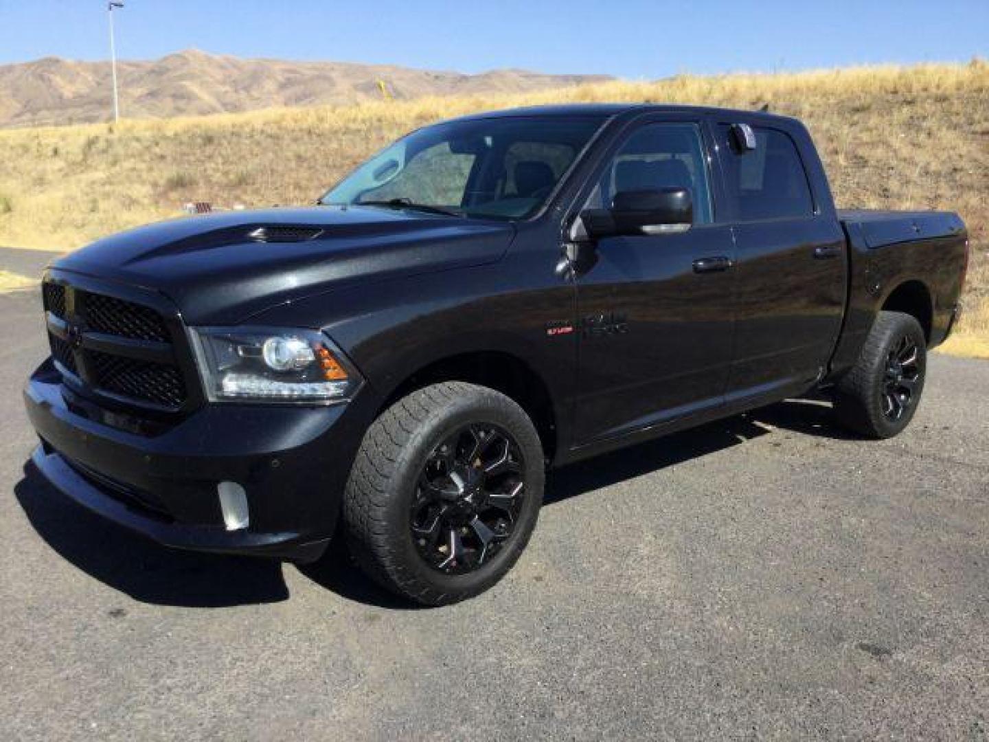 2018 Brilliant Black Crystal Pearl Coat /Black, leather RAM 1500 Sport Crew Cab SWB 4WD (1C6RR7MT8JS) with an 5.7L V8 OHV 16V engine, 8-Speed Automatic transmission, located at 1801 Main Street, Lewiston, 83501, (208) 743-9371, 46.417065, -117.004799 - Photo#0