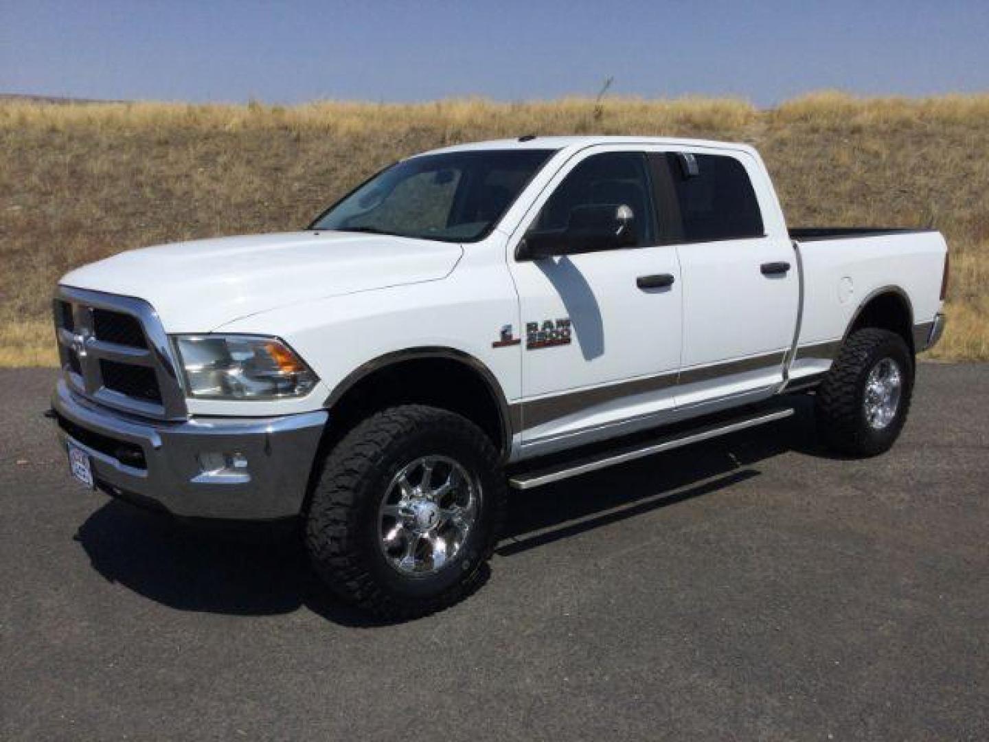 2013 Bright White Clearcoat /Diesel Gray/Black RAM 2500 SLT Crew Cab SWB 4WD (3C6UR5DL2DG) with an 6.7L L6 OHV 24V TURBO DIESEL engine, 6-Speed Automatic transmission, located at 1801 Main Street, Lewiston, 83501, (208) 743-9371, 46.417065, -117.004799 - Photo#0