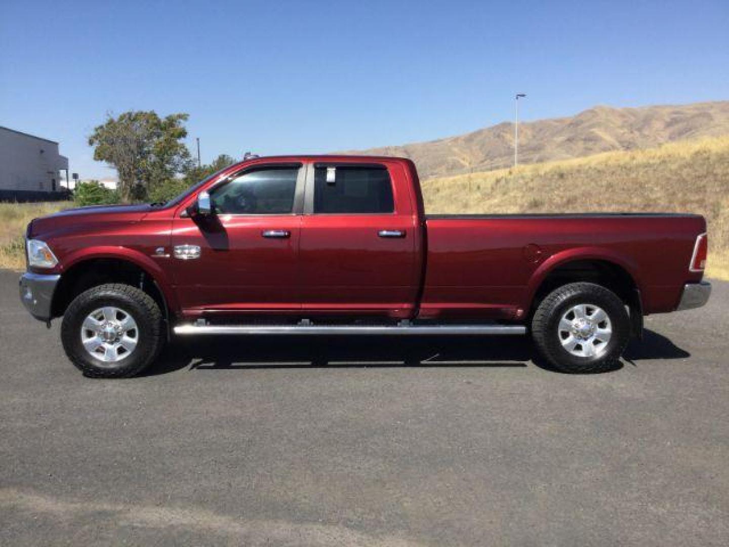 2016 Delmonico Red Pearl Coat /Canyon Brown/Light Frost Beige, premium leather RAM 3500 Longhorn Crew Cab LWB 4WD (3C63R3KLXGG) with an 6.7L L6 OHV 24V TURBO DIESEL engine, 6-Speed Automatic transmission, located at 1801 Main Street, Lewiston, 83501, (208) 743-9371, 46.417065, -117.004799 - Photo#1