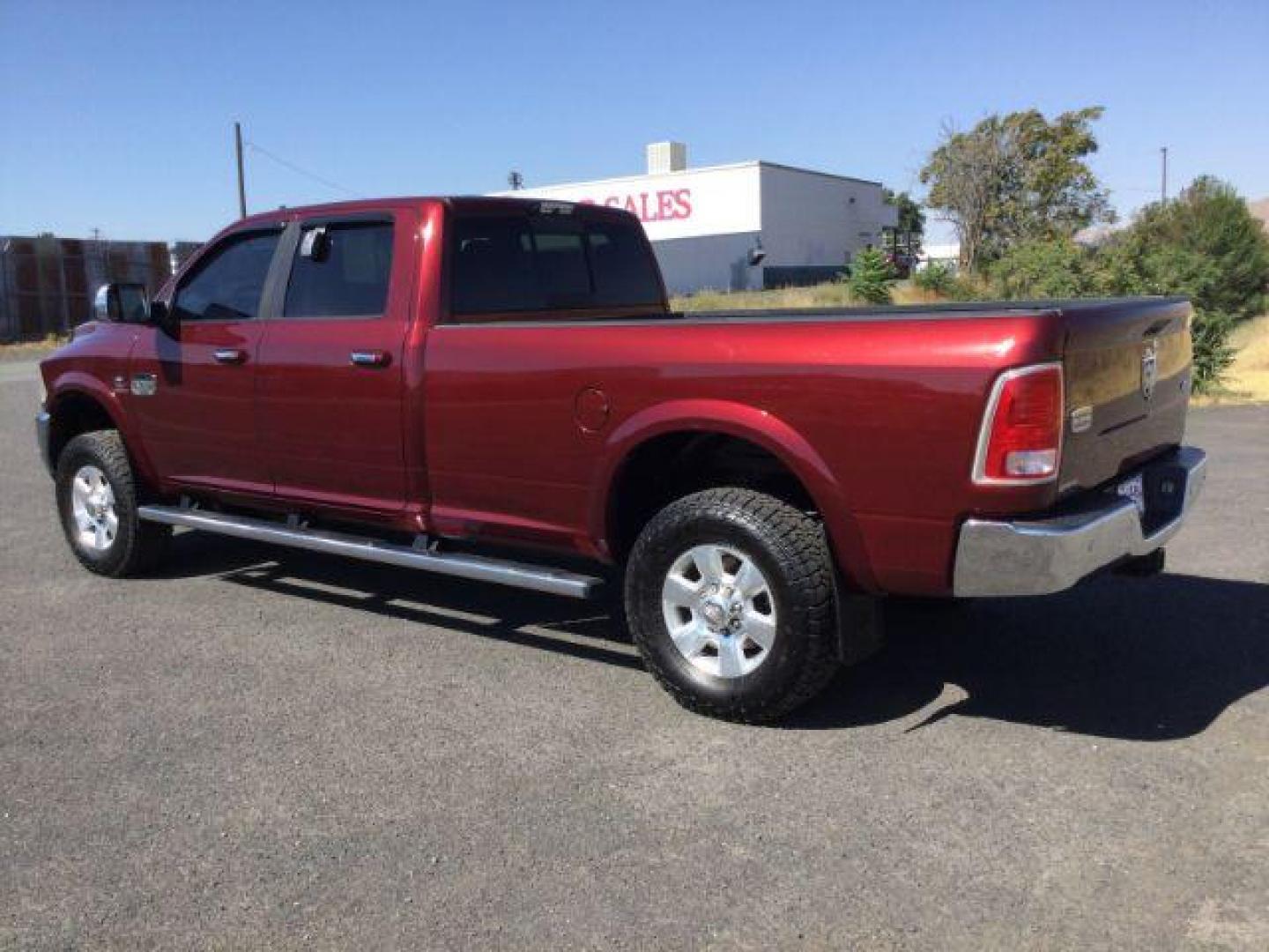 2016 Delmonico Red Pearl Coat /Canyon Brown/Light Frost Beige, premium leather RAM 3500 Longhorn Crew Cab LWB 4WD (3C63R3KLXGG) with an 6.7L L6 OHV 24V TURBO DIESEL engine, 6-Speed Automatic transmission, located at 1801 Main Street, Lewiston, 83501, (208) 743-9371, 46.417065, -117.004799 - Photo#2